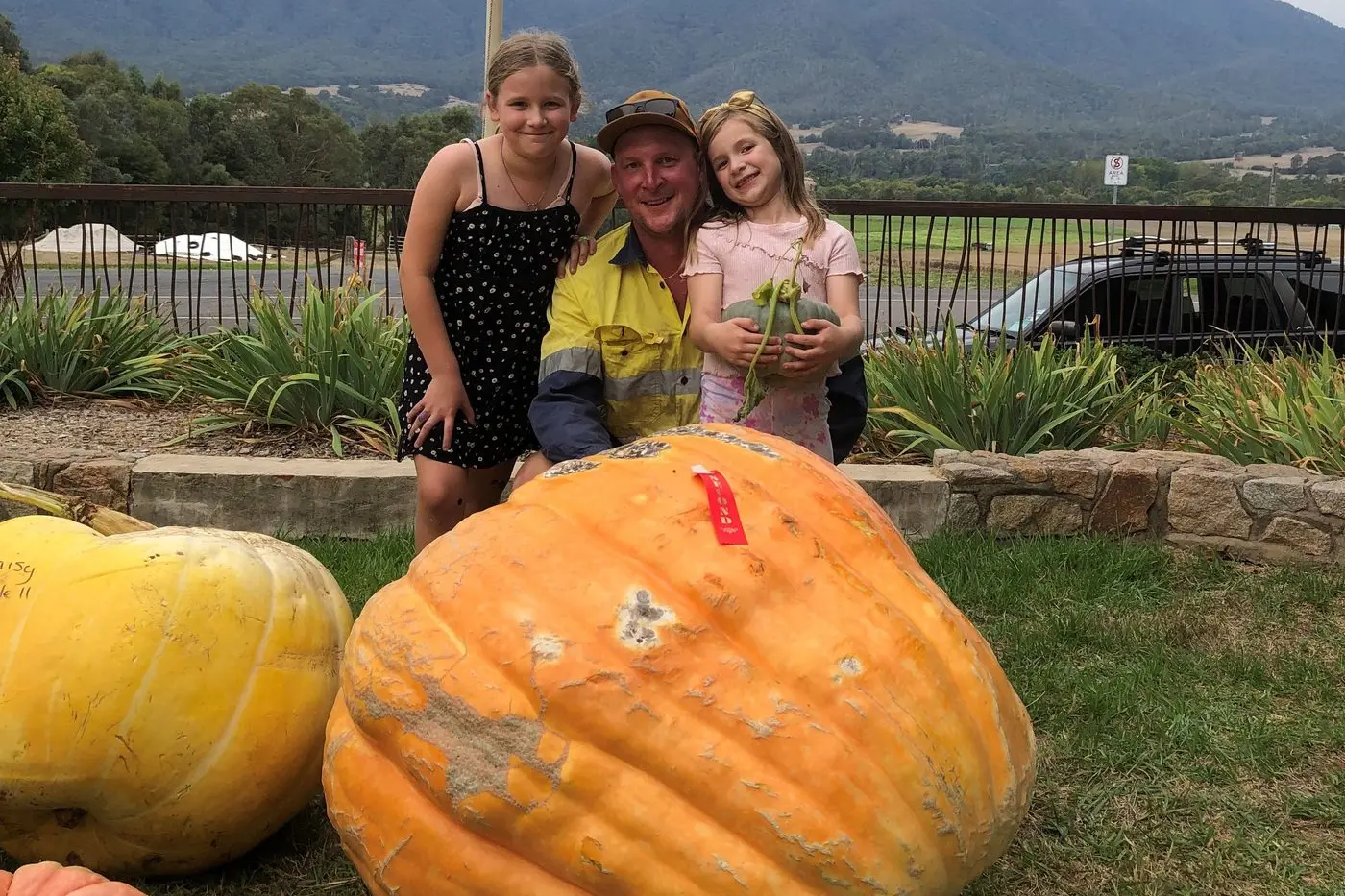 BIGGEST OF THEM ALL: The Richardsons - Lyla, Brenton and Millar - were delighted that their 160kg pumpkin won the title of Tawonga\\'s heaviest pumpkin.