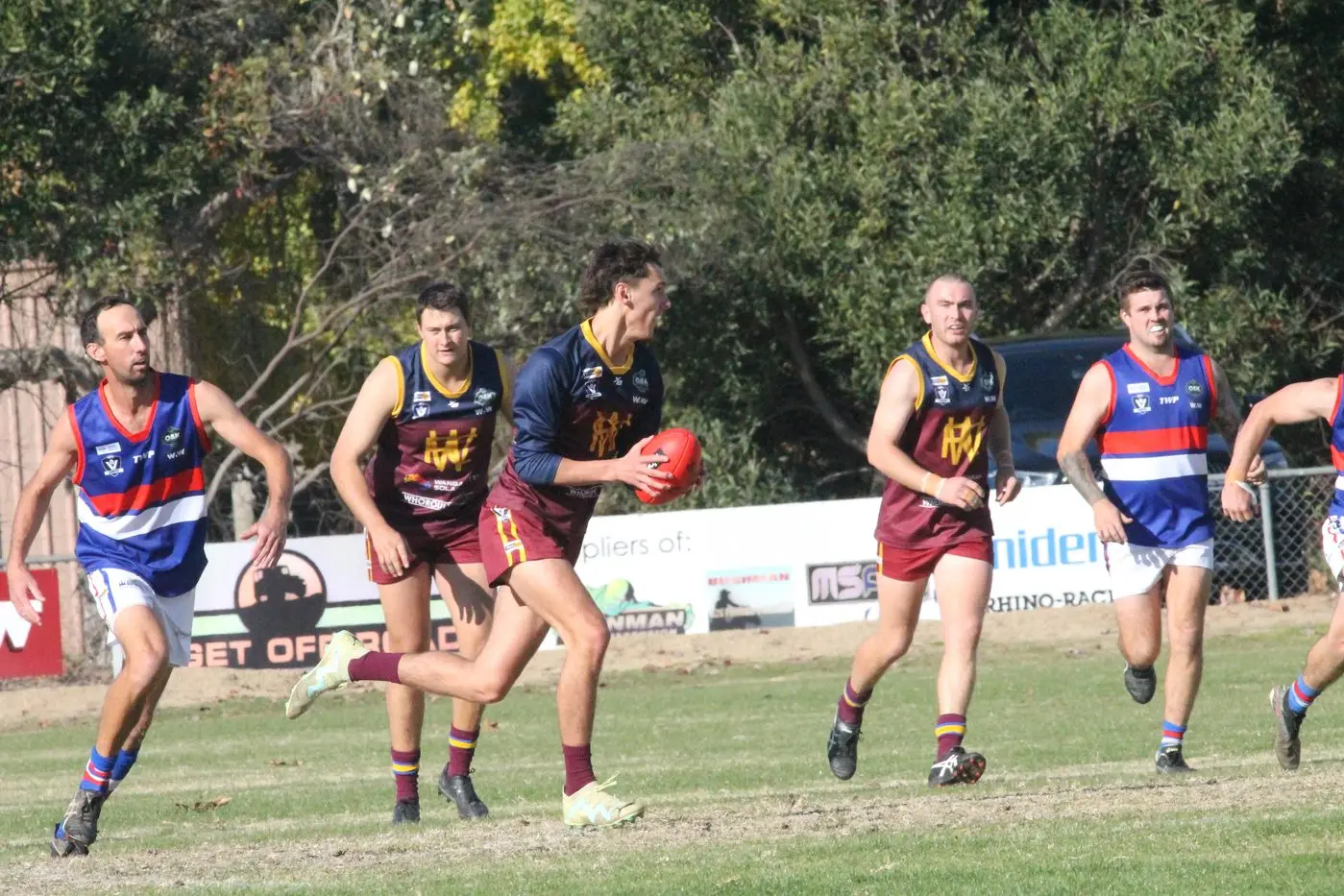 PACE: Ollie Dixon tears through the centre of the ground in the Lions\\' win over Tarrawingee. PHOTOS: Nathan de Vries