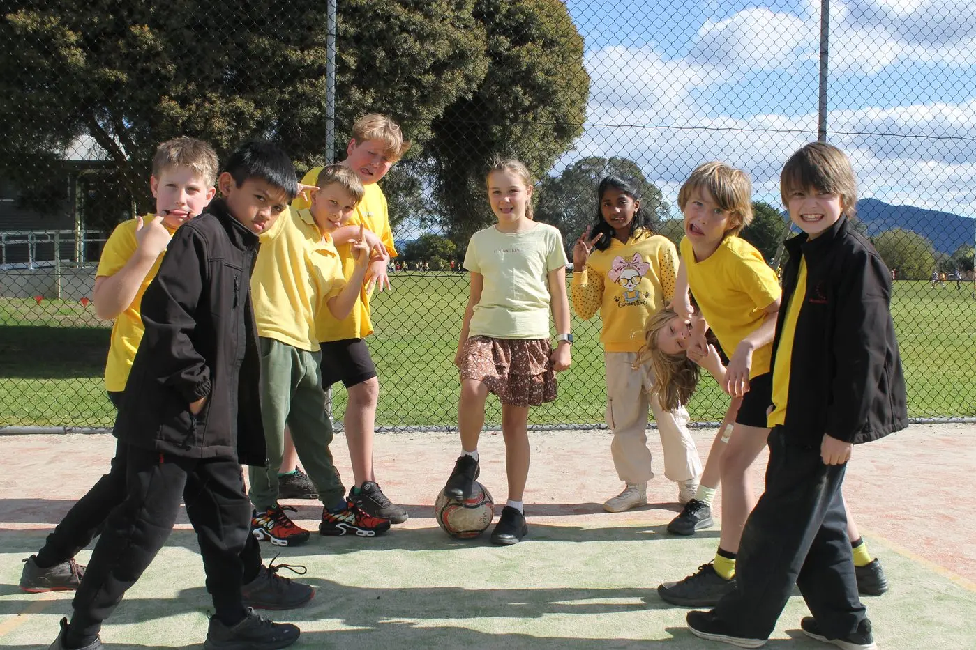 ARE YOU OK? Myrtleford P-12 College students from the Years 3 to 6 classes (from left) Alex Benci, Mark Roque, Henry Hayfield, Ali Ramia, Collins Procter, Leanne Anish, Chloe Tucker, Olly Barbisan and Sammy Benci finished off RUOK? Day with a spirited game of soccer with their fellow classmates. PHOTOS: Phoebe Morgan