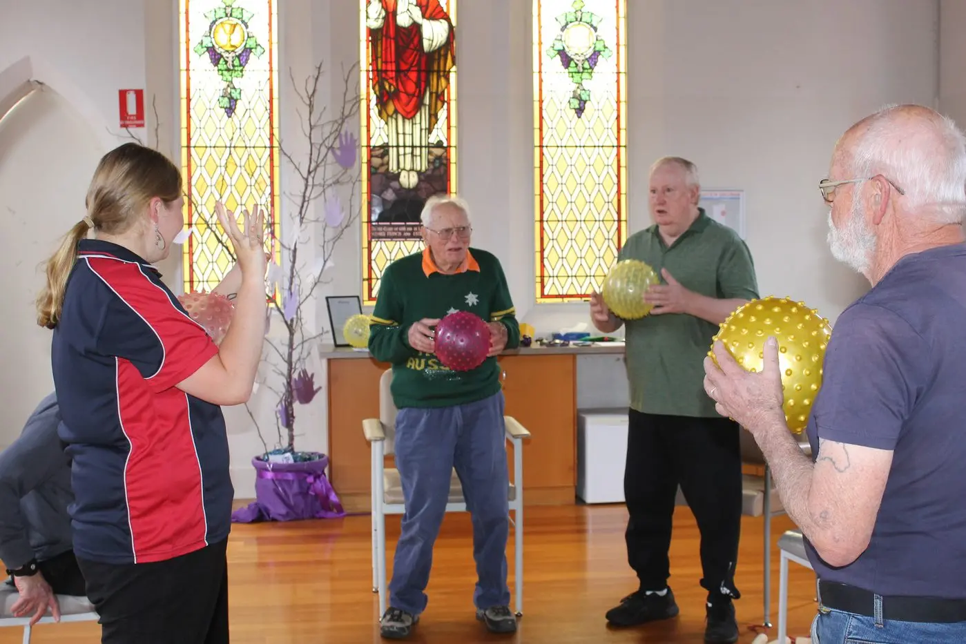 STRENGTH SKILLS: Practicing physical therapy to prevent injuries and strengthen muscles are (from left) Gateway Health instructor Rachel Fischer, George McPherson, Brad Evans and Trevor Isherwood.
