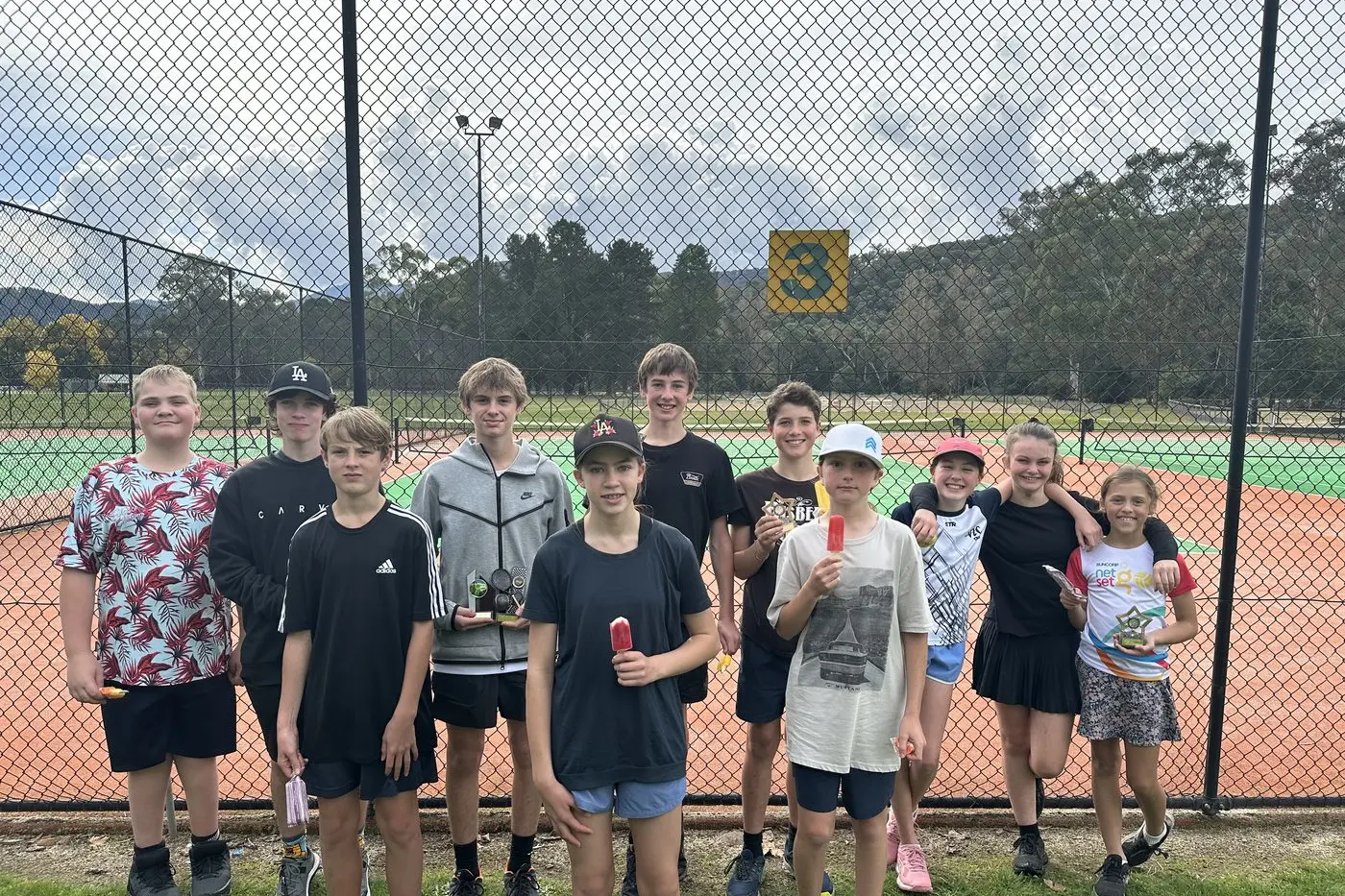 SPOILS OF VICTORY: Bright Tennis Club juniors (back, from left) Harry Dudley, Nic Carey, Tom Russell, Lachlan Russell, Audie Whyte, Riley Turner, Renae Black, Ingrid Barnard, (front, from left) Luke Carey, Amelie Kerr and Elliott Ford enjoying some well\\u2013deserved ice cream after the junior club championships on the weekend. Id:40652