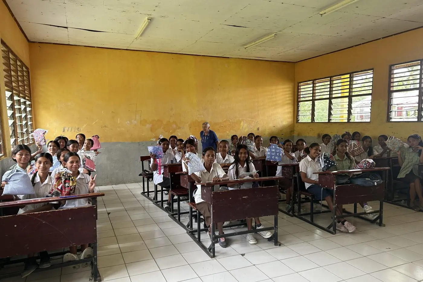 SCHOOL SUPPLIES: Barbara Broz (rear) with a class of students who received a Days for Girls bag from local Myrtleford sewing volunteers. PHOTO: FOL
