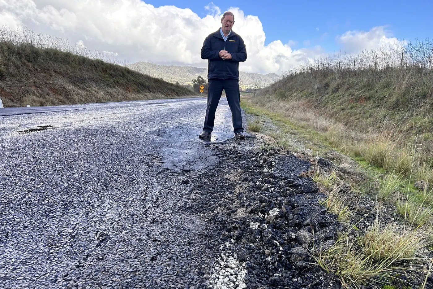 ROAD NEGLECT: Ovens Valley state MP Tim McCurdy said a $1 billion budget boost for Melbourne suburb roads is a slap in the face for regional Victorians driving on deteriorating and neglected roads.