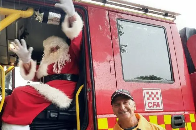 RED RIDE: Father Christmas and Geza Kovaks test-drive Santa\\'s new sleigh. PHOTOS: Lorraine Hughes and Renee Lee