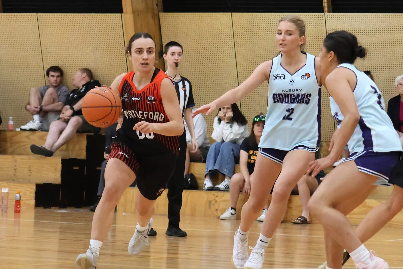 PRESSURE PLAYER: Paige Zamperoni drives towards the basket against the Cougars. PHOTOS: Janet Watt