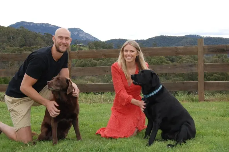  HE\\'S BACK: Ben and Erin Reid with their two Labradors, Jax and Indy. PHOTO: Nicki Letts