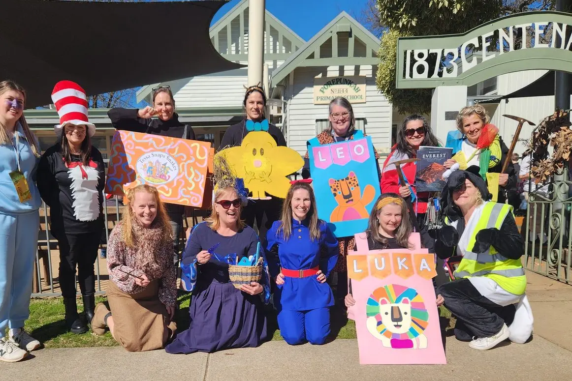 ENGAGING EDUCATION: Porepunkah Primary School staff (from left) Miss Charlotte, Ms Rivette, Ms Davies, Madame Rupp, Ms Bevan, Ms Cunningham, Miss Jenny, Ms Neilson, Principal Gillies, Ms Purtell, Miss Carly and Ms Paul, led the way and celebrated book week with wildly varied wardrobes. PHOTOS: Porepunkah PS