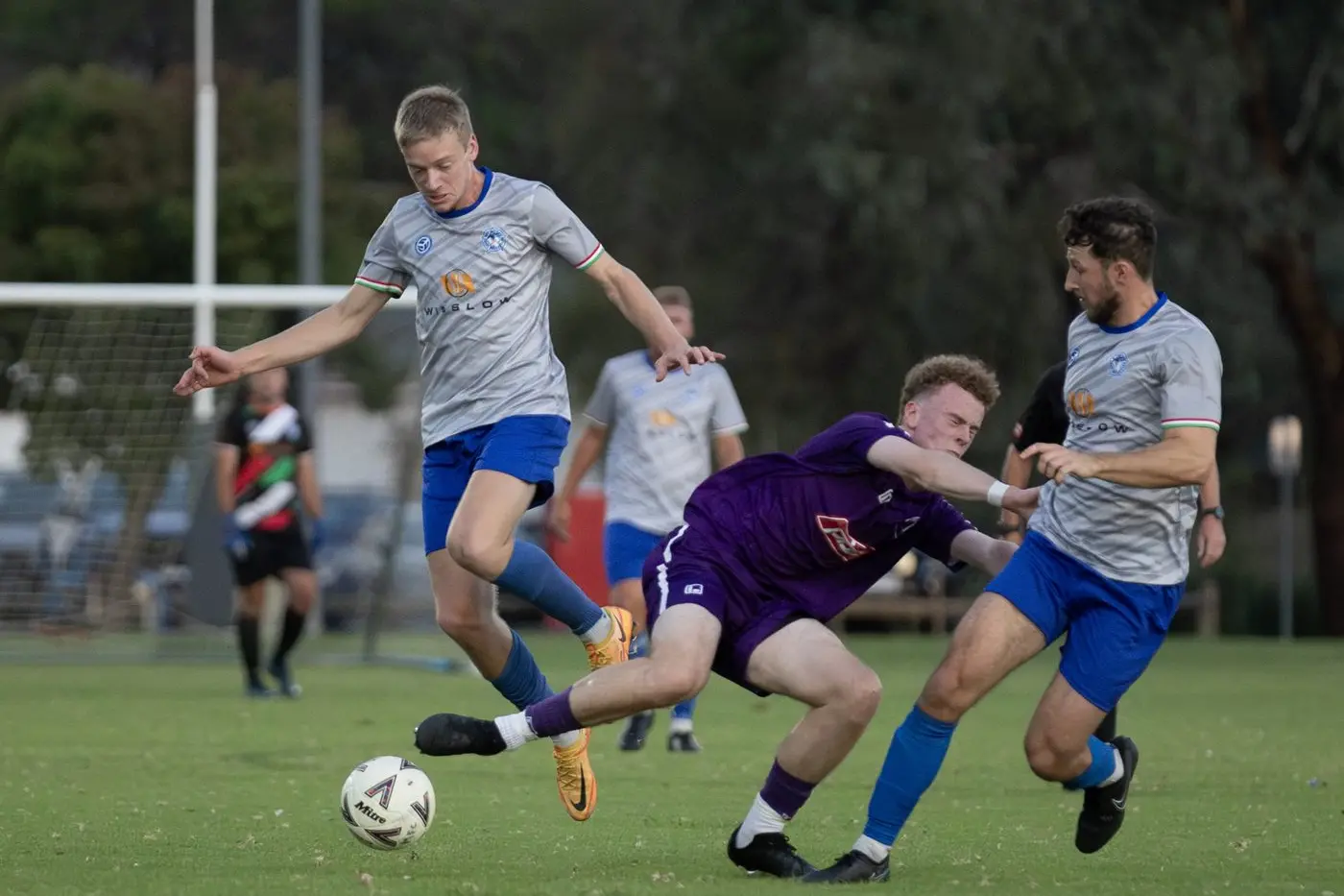 LEAPING EFFORT: Scott Peggie bounds over the leg of his Melrose opponent in Savoy\\'s 2-1 win. PHOTOS: Melissa Beattie