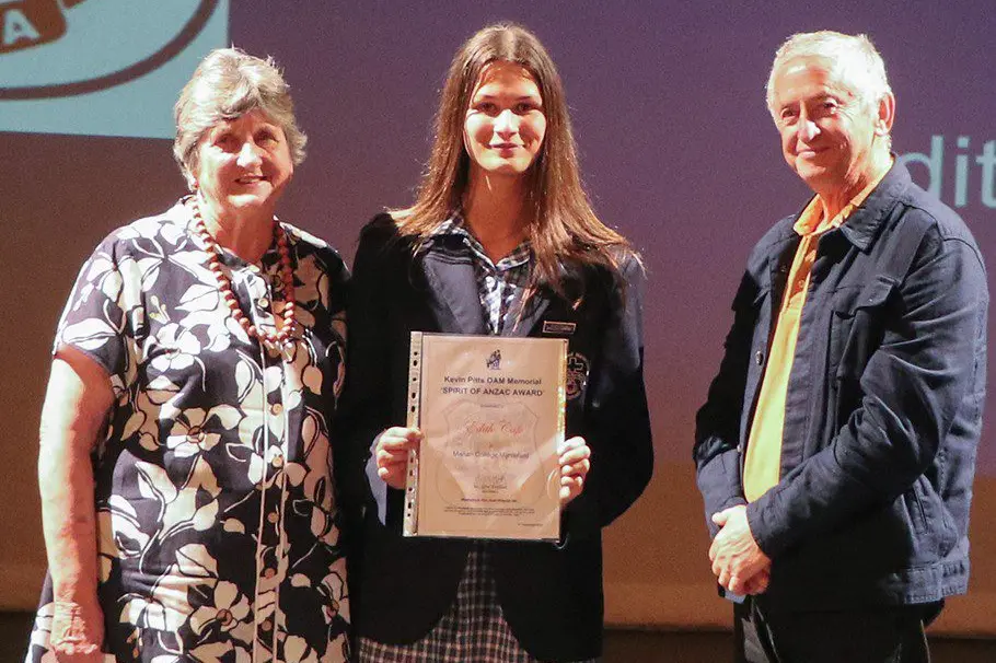 SCHOOL SPIRIT: Myrtleford RSL member Joe Caruana presented the \\u2018Kevin Pitts OAM Memorial SPIRIT OF ANZAC Award\\u2019 to Year 11 student Edith Cafe (centre), pictured with Judy Pitts.