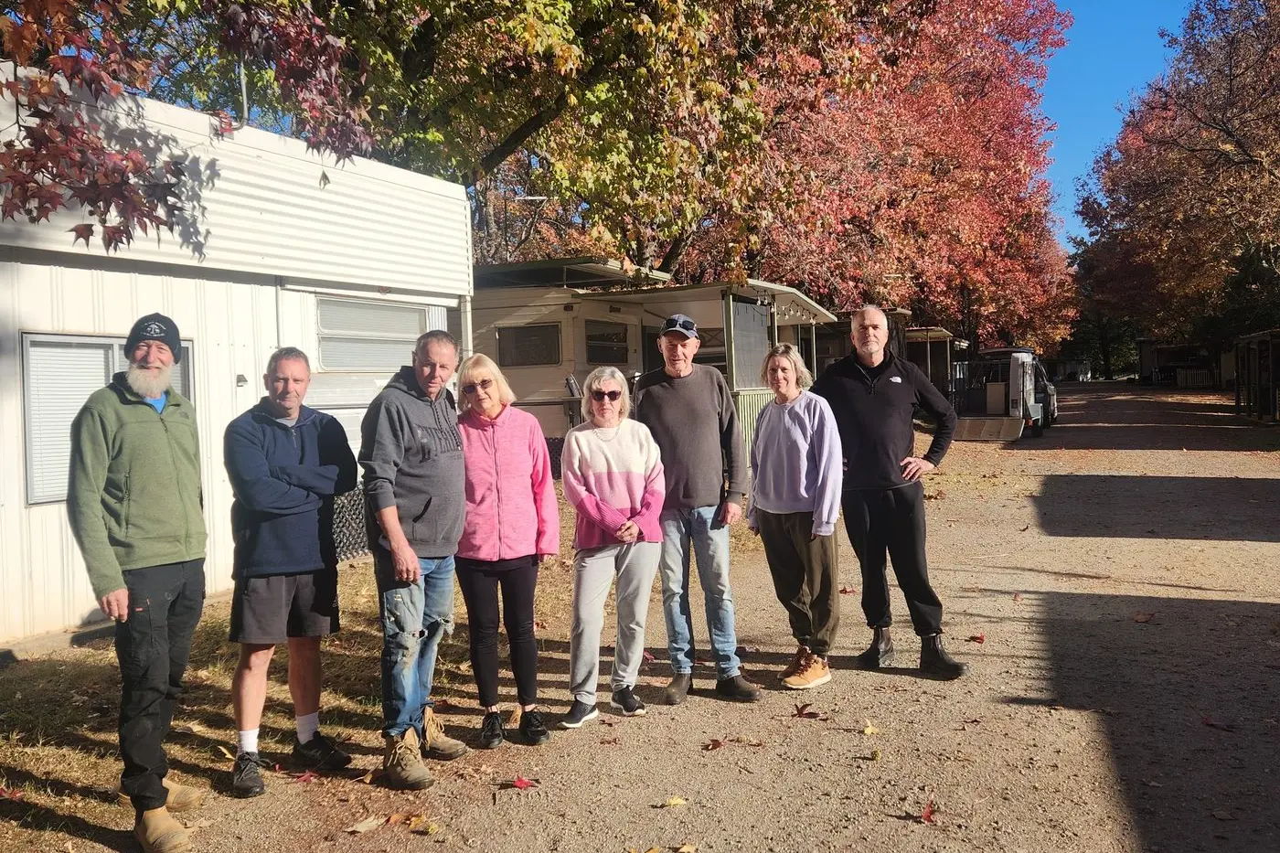 WOEFUL WEEKEND WORK: (from left) Annual site holders at Porepunkah\\'s Big4 Holiday Park; Andrew Van Duynhoven, Michael Ball, Bruce Giggins, Sharon Giggins, Jennifer Taylor, Gvan Taylor, Vanessa Ede-Scott and James Scott, among others, gathered to disassemble their caravan sites on the weekend.