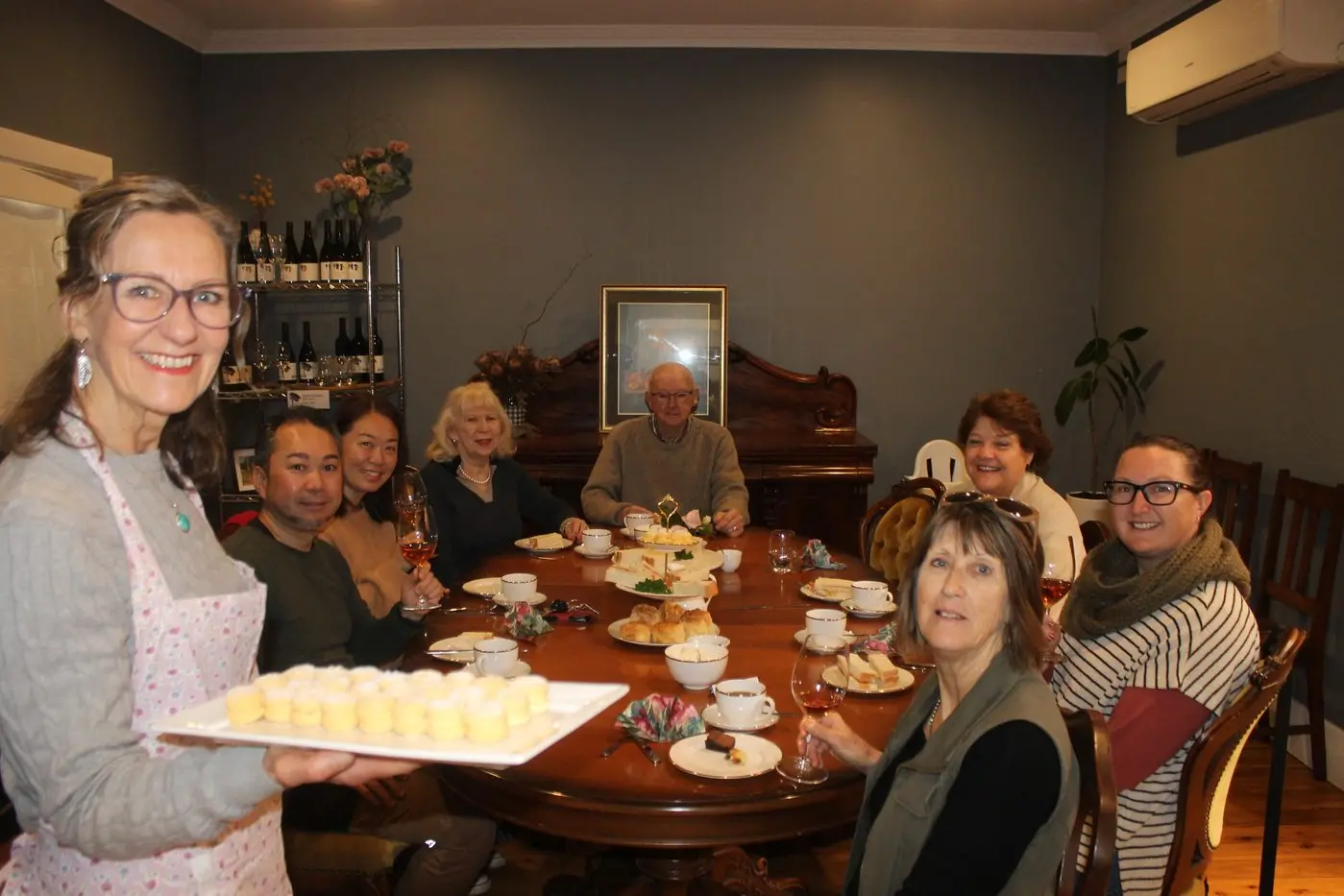 HAVE A CUPPA FOR CHARITY: Judy Anderson (left) with Yasuaki and Taeko Tokuda, Rhonda Shallcross, Jim Oastler, Helen McNamara, Helen Hunter and Kate McNamara celebrated Myrtleford\\'s social side at Bush Track Wines\\' Biggest Morning Tea last Friday. PHOTOS: Phoebe Morgan