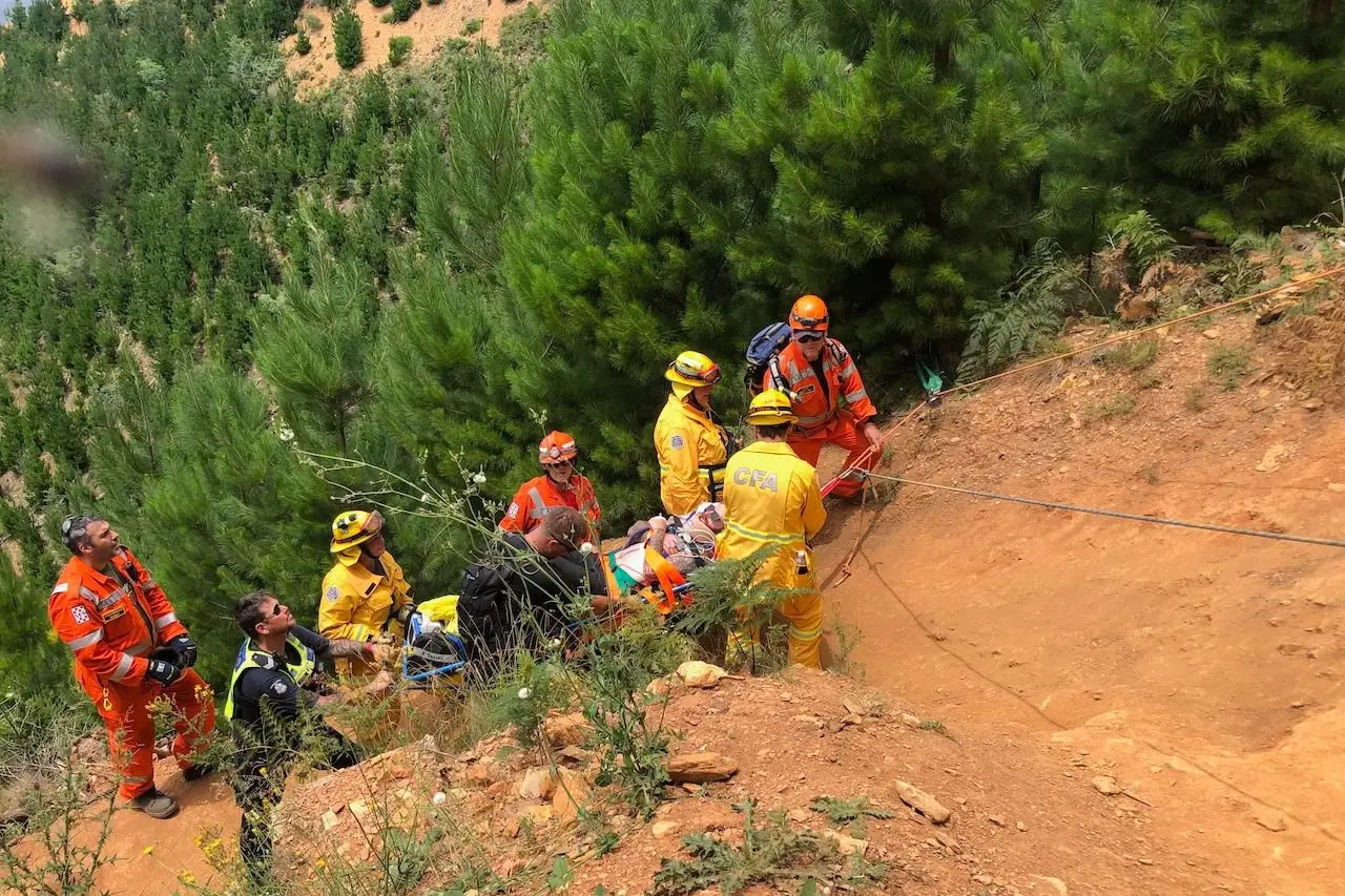 LOOKING FOR LEVEL GROUND: Emergency services navigated difficult terrain to maneuver a patient to the ambulance waiting at the top of the hill. PHOTOS: Bright SES