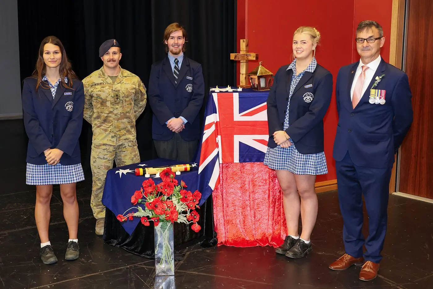 HONOURING THEIR SACRIFICE: Helping officiate at the ANZAC Day service last week were (from left) Edith Cafe, Lieutenant Byron Brun-Smits, Jack Byrne, Lily Burton, and Bryan Meehan (Myrtleford RSL). PHOTO: Michael Guinane 