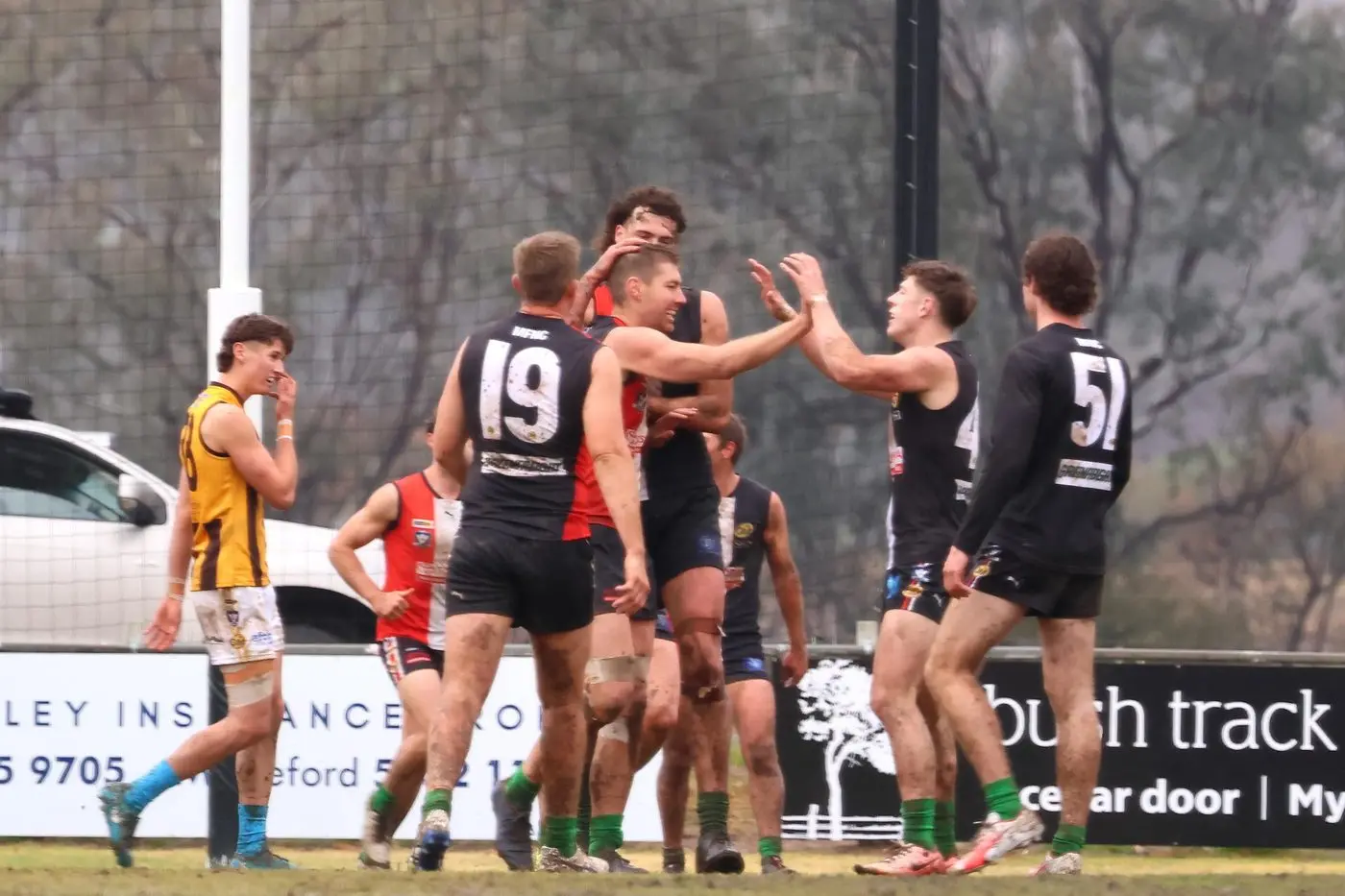 MARCHING IN: The Saints converge around Jake Sharp in the Saints\\' emphatic 44-point win over reigning premiers Wangaratta Rovers. PHOTOS: Janet Watt