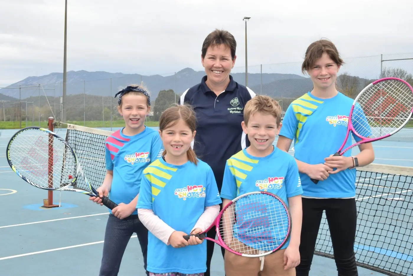 TENNIS TIME: Jayne Pozzan (centre) with tennis hotshots players (from left) Mackenzy Reynolds, Brodie Pozzan, Spence Reynolds and Aimee Pozzan can\\'t wait for the season to start. PHOTO: Brodie Everist Id:31323