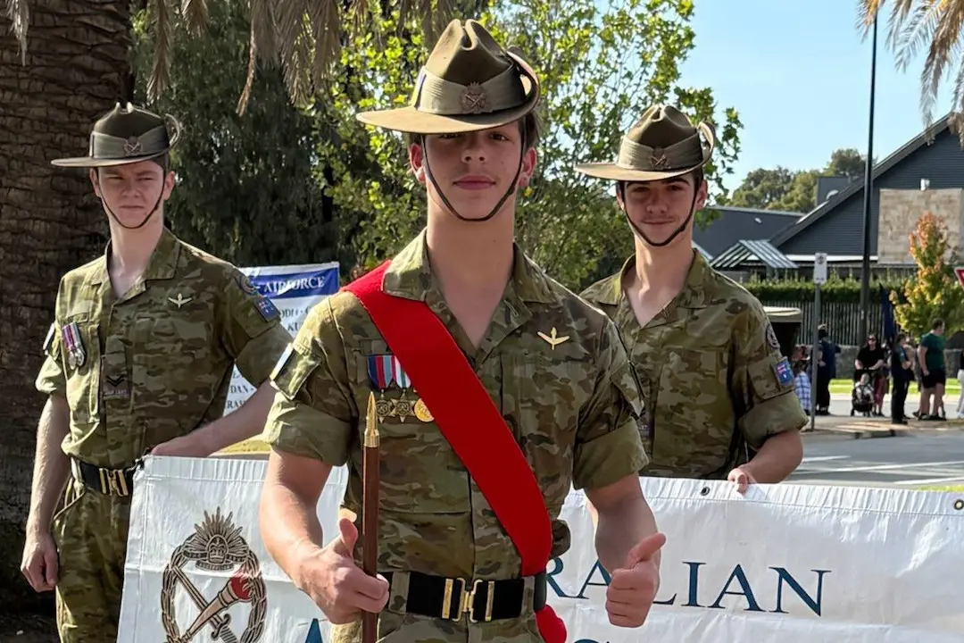 THUMBS UP: Company Sergeant Major Mason Anders (red sash) with members of his unit.