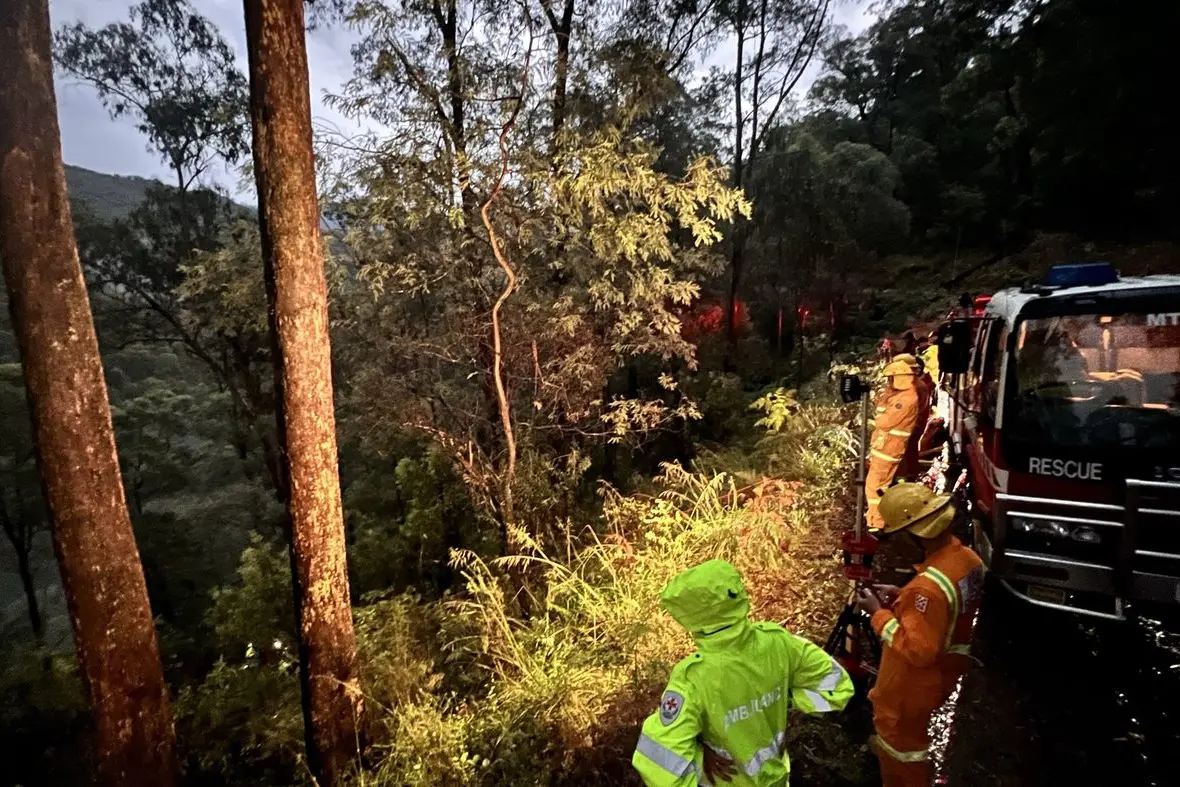 GORGE GAP: Members of the emergency services waited for the recovered people to walk up to safety after their ordeal.