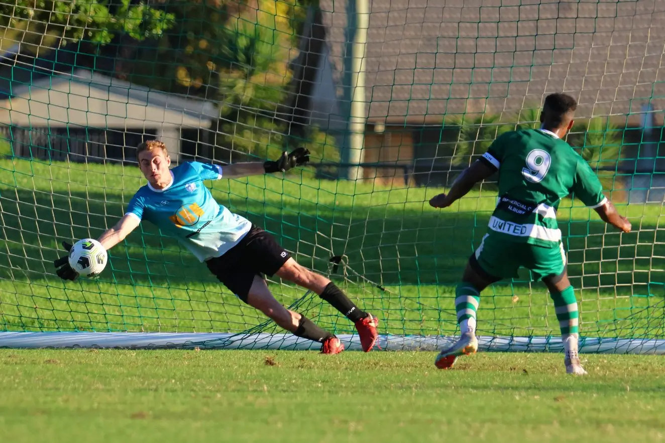 SAVED: Nathan Gleeson saves a penalty from Milkie Woldermichael to keep a clean sheet. PHOTOS: Janet Watt