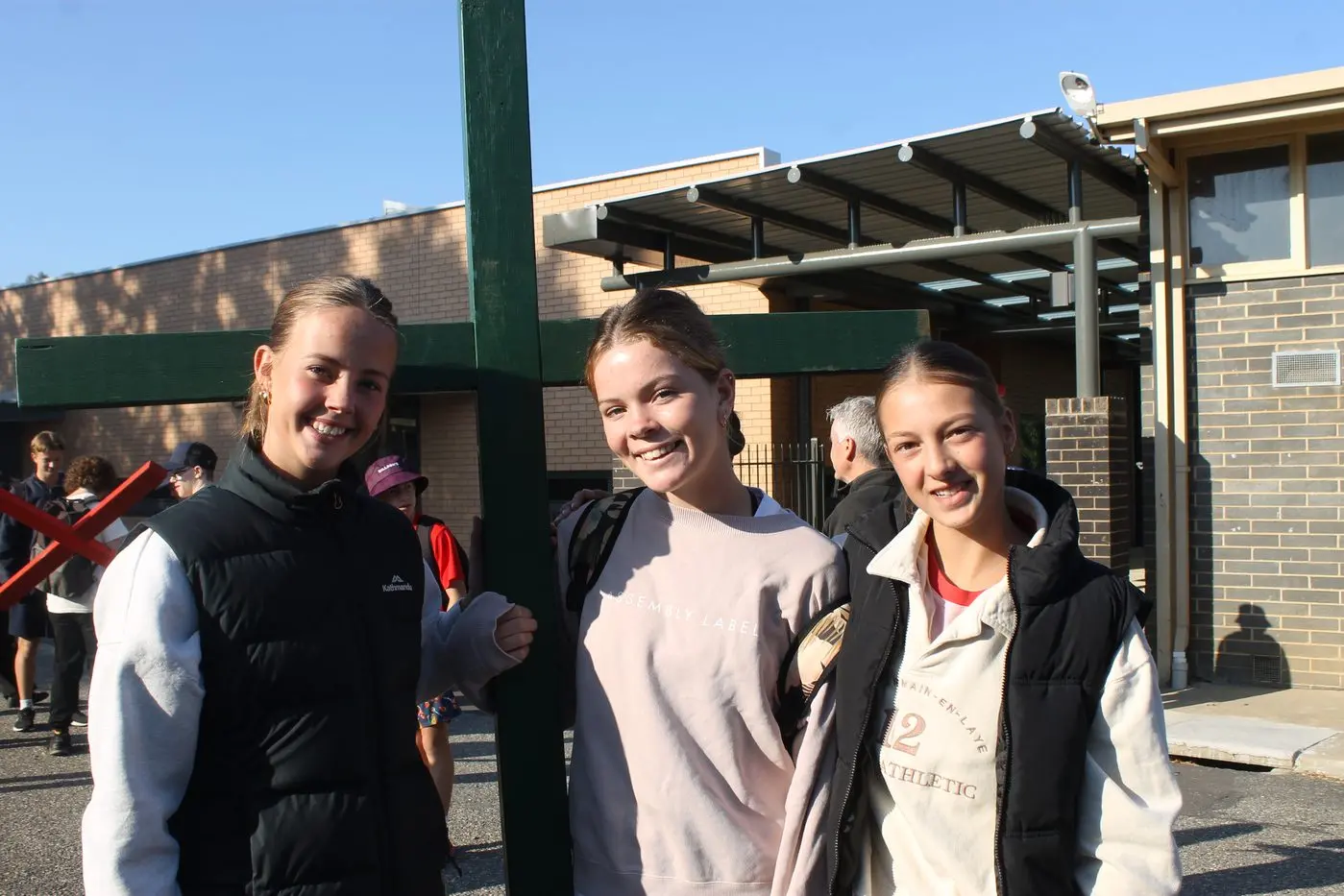 MORNING MARCH: Marian College students (from left) Zahra Hazeldine, Milla Corcoran and Emma Pasqualotto helped their group carry their cross, as they walked in aid of accessible third-world water resources. PHOTOS: Phoebe Morgan.