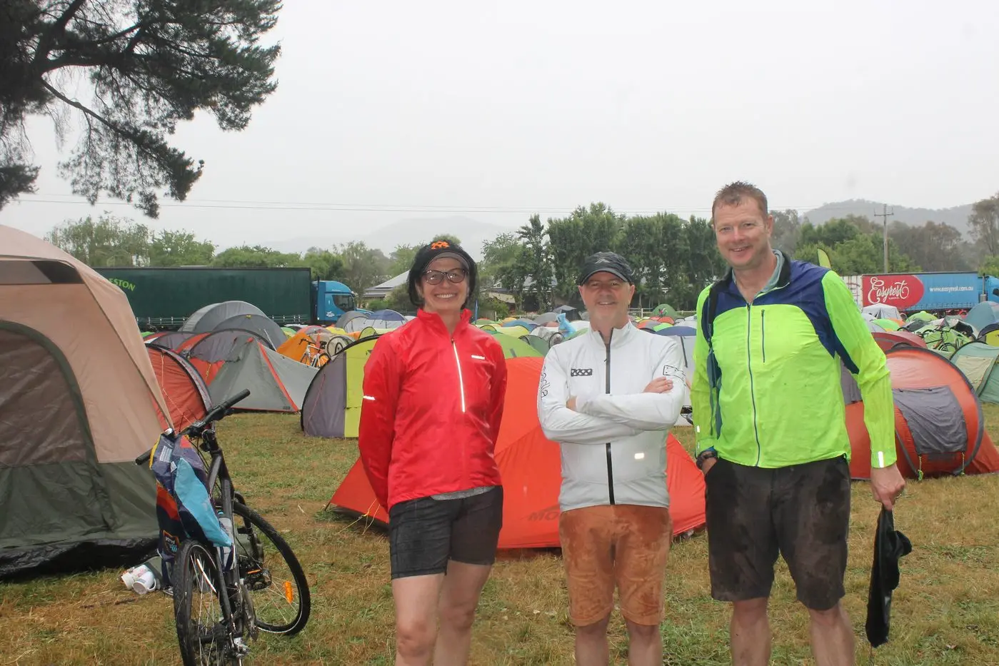 POSITIVE OUTLOOK: Jackie Reynard, Jim Mortimer and Kevin Reynard braved the wet weather to enjoy the GVBR celebrations at the Myrtleford Recreation Reserve on Sunday.