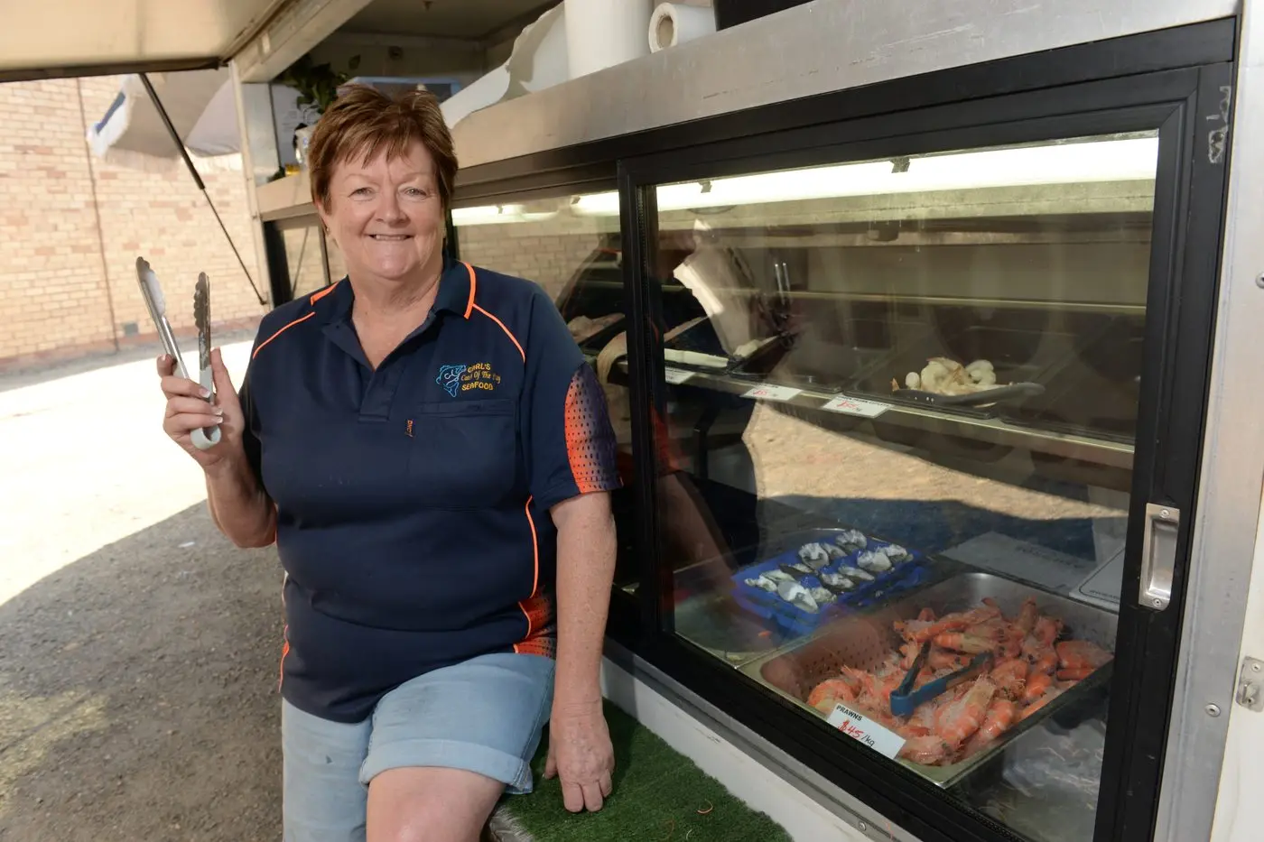 CATCH OF THE DAY; Seafood retailer Jenny Hughes was busy on Myrtleford\\u2019s Standish Street last week selling fish in the lead up to Good Friday.  PHOTO: Brodie Everist