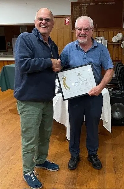 WELL DESERVED: John Costello (right) with Myrtleford Golf Club president George Browne.