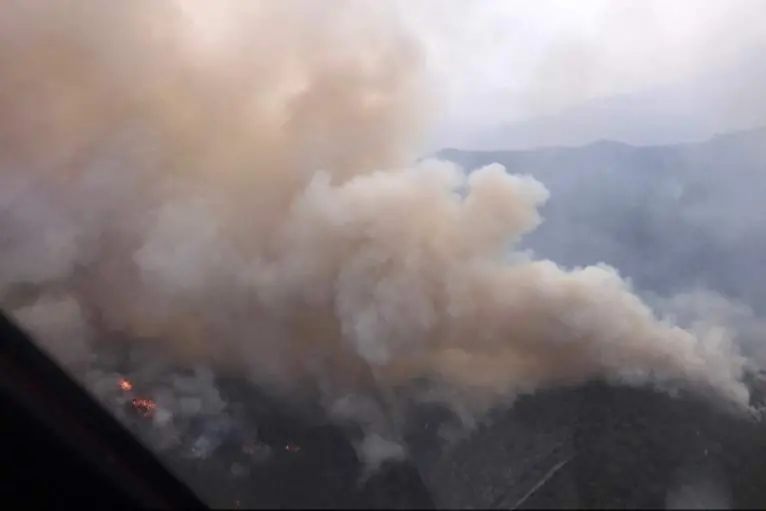 AERIAL SHOT: Much of the smoke visible across the Alpine Shire is coming from the Abbeyard Yarrarabulla firem which joined with Mount Buffalo on the weekend. PHOTO: FFMVic