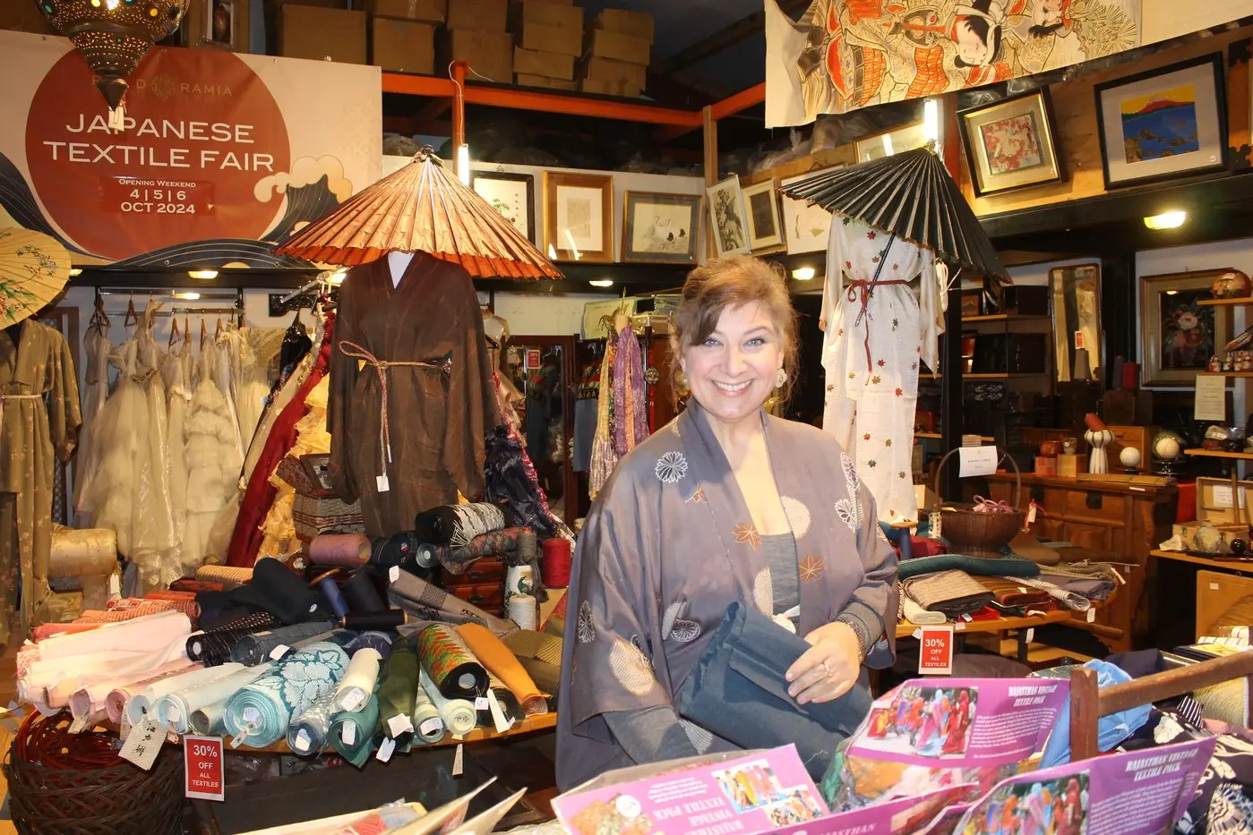 TERRIFIC TEXTILES: Louise Pike was at the ready to serve customers looking for cultural couture. 