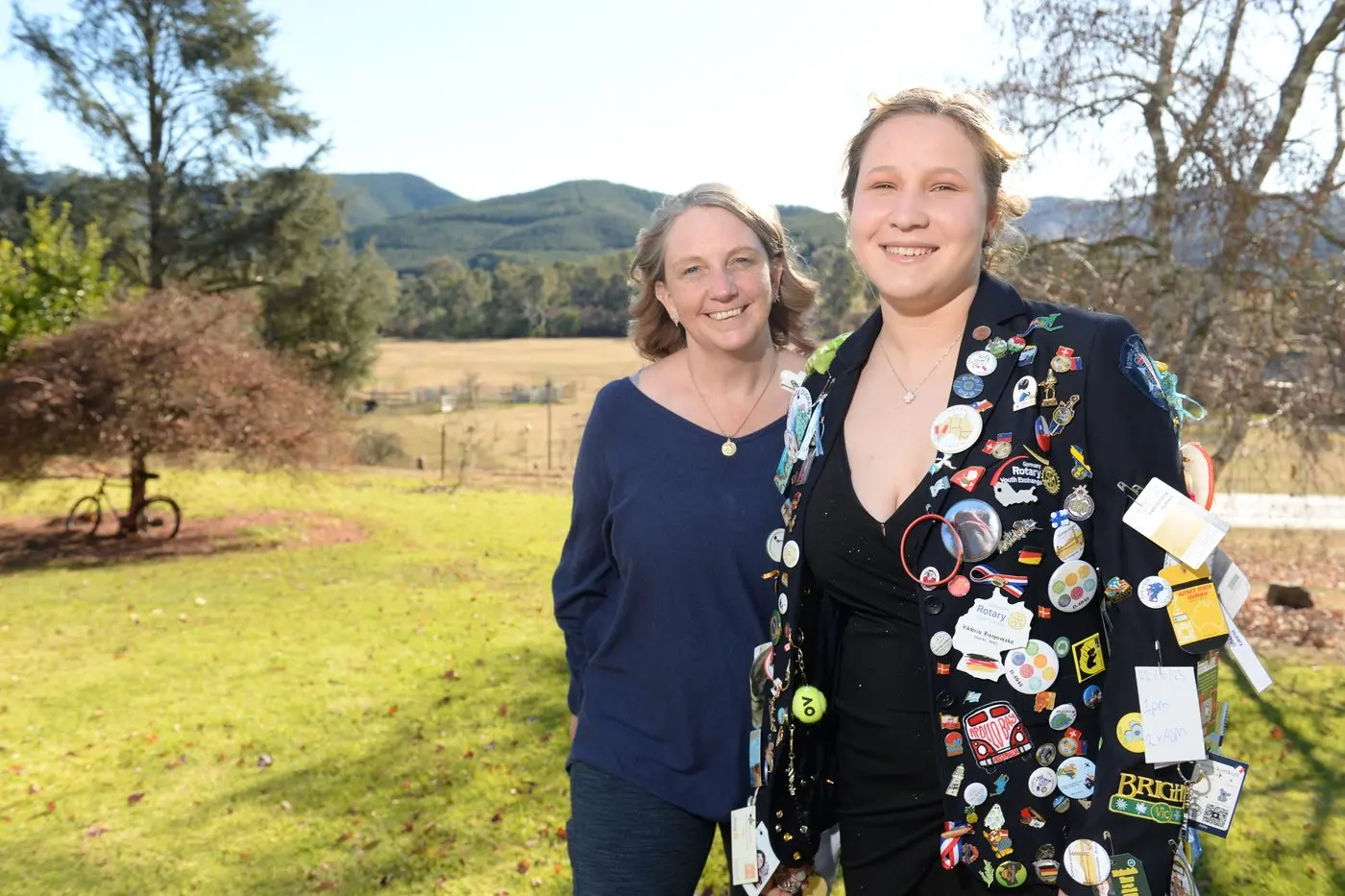 SAFE TRAVELS: Rotary exchange student Viki Risnyovska, with host parent Kelly Barton, wearing her blazer covered with pins and badges from other exchange students she met during her travels. PHOTO: Brodie Everist 
