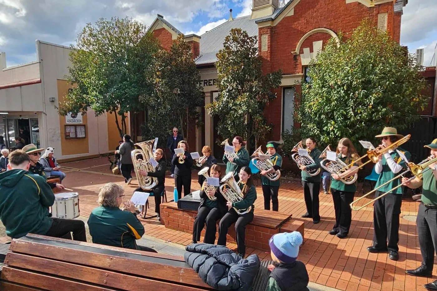 LIBRARY RETURNS: One of the Creswick Brass Band\\'s stops this year was the Bright Library, to entertain the town. PHOTOS: Linda Ely, David and Meg Moorhouse + Skunkworks Community.