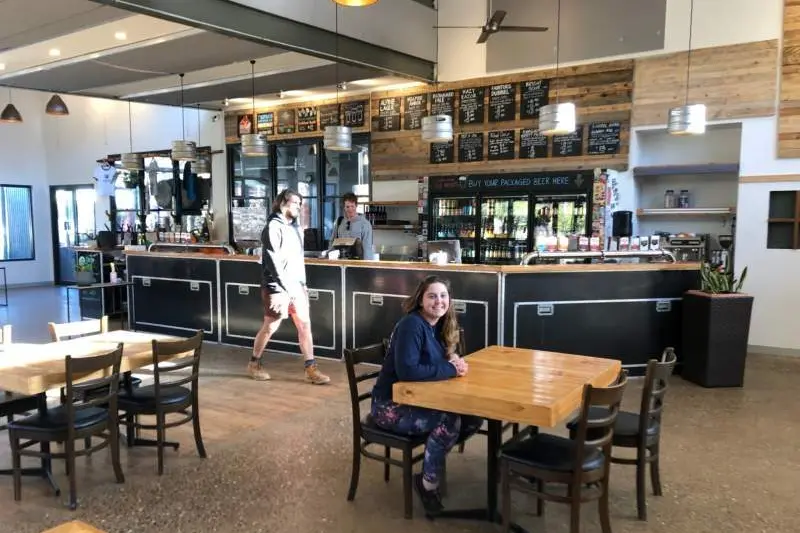 BACK IN ACTION: Brewery staff Madi Louise, Harry Borthwick and Joel Bannister get ready to open the doors next week.\\nPHOTO: Nicki Letts