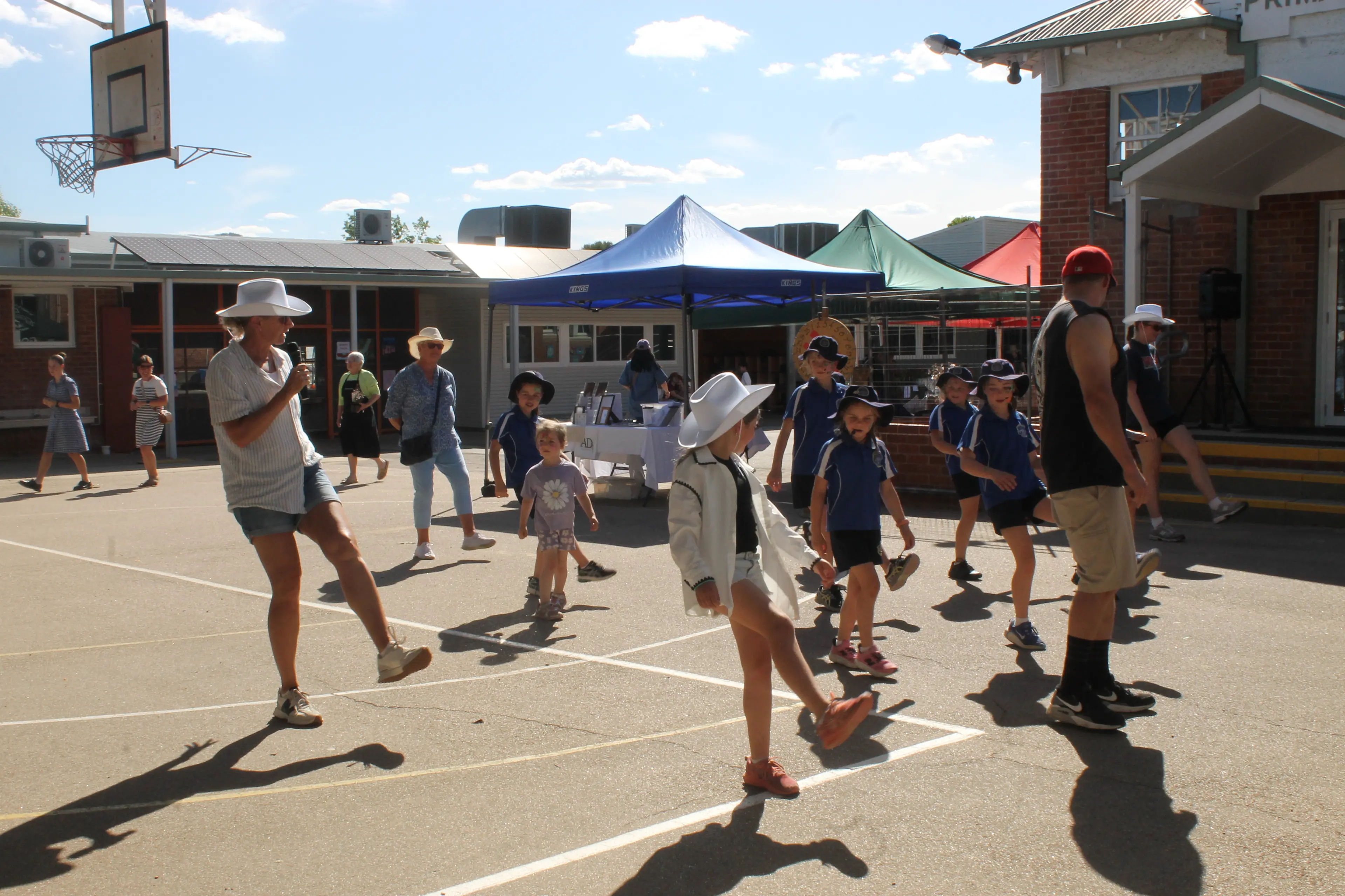<p>LINE-UP LESSONS: St Mary\\'s fete was boot-scootin\\' fun as Kim Rosatto taught participants how to line-dance. PHOTOS: Phoebe Morgan</p>\\n