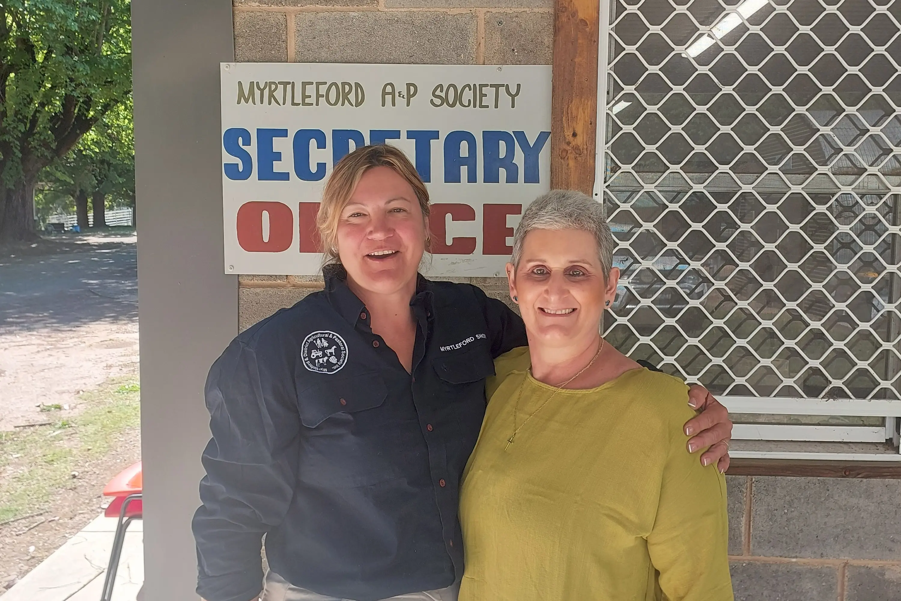 <p>SUPPORTING LOCAL: Myrtleford Show Society president Debbie Geddes (left) with raffle fund donation awardee Marcella White.</p>\\n