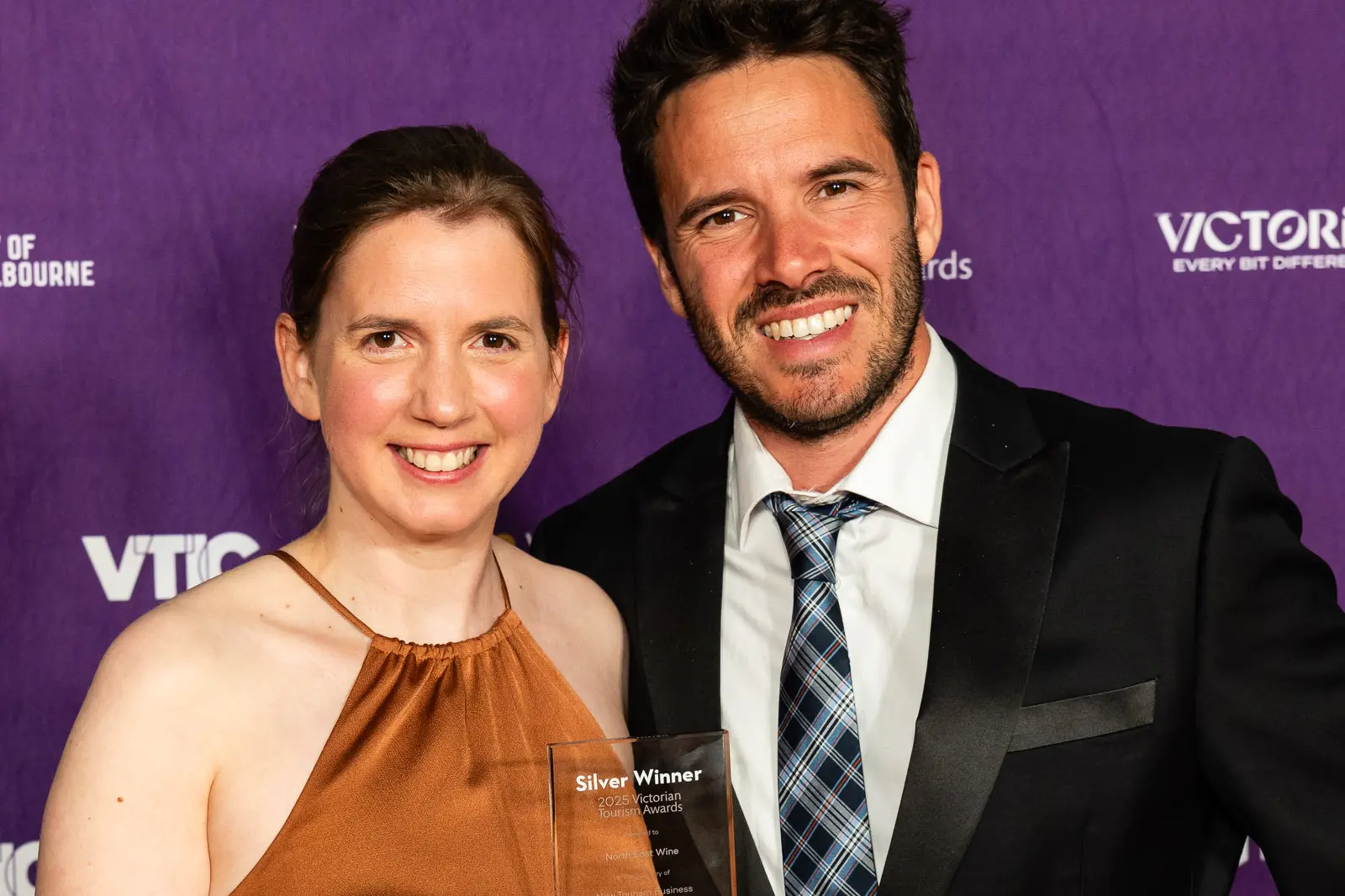 <p>ALPINE ACCOLADE: Marion Carrabin and Julian Faelli from North East Wine accepted the Victorian Tourism Awards silver trophy for 2025 as (second) best \\'New Tourism Business\\'. PHOTO: NE Wine</p>\\n