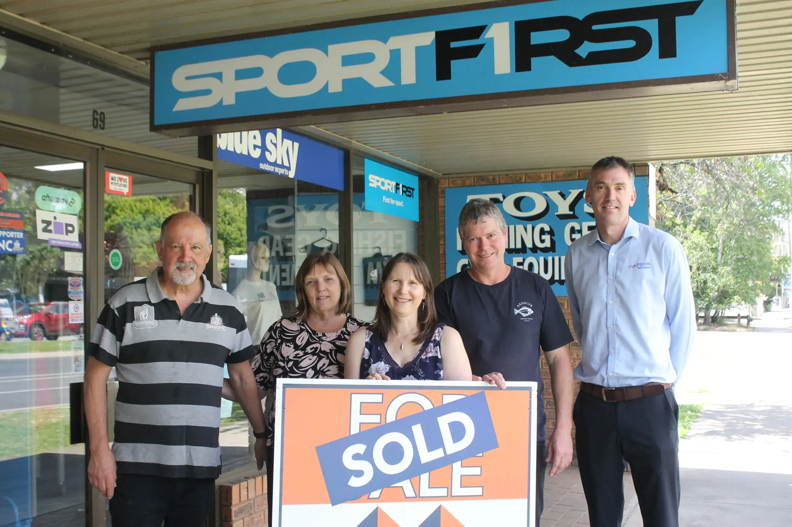 <p>SPORTF1RST SOLD: Paul and Wendy Maskell (left), passed ownership of SportF1rst to Julie and Matt Sinnett last week. They are pictured with principal agent Ben McIntyre (right) celebrating the successful transition of Myrtleford\\'s sporting supply store into new hands. PHOTO: Phoebe Morgan</p>\\n
