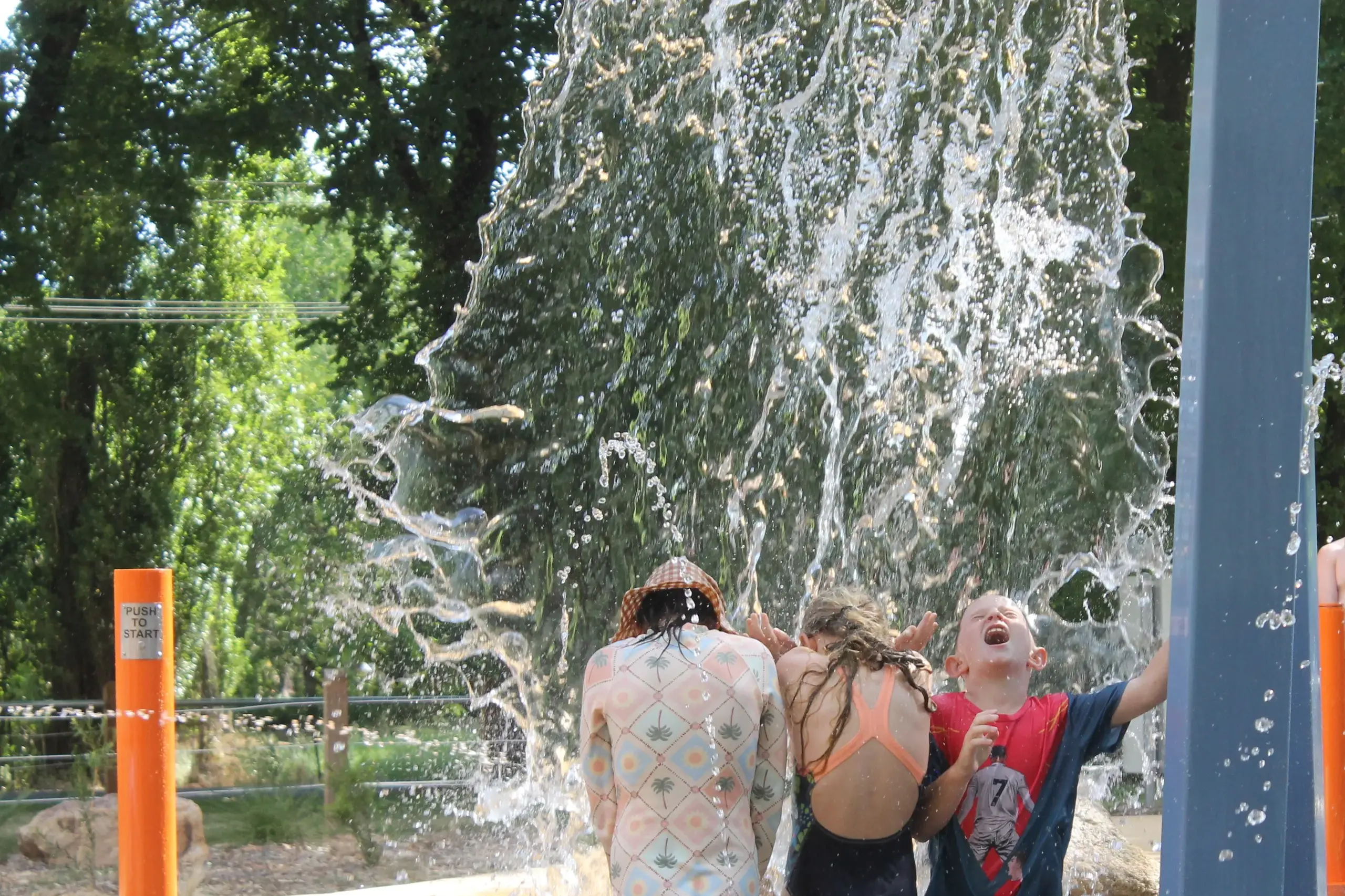 <p>PLAYGROUND POUR: (from left) Stella Fin, Sienna Marotta and Chase Withers had to be under the right bucket at the perfect time to get a thorough drenching at the Myrtleford Splash Park last week. PHOTOS: Phoebe Morgan</p>\\n
