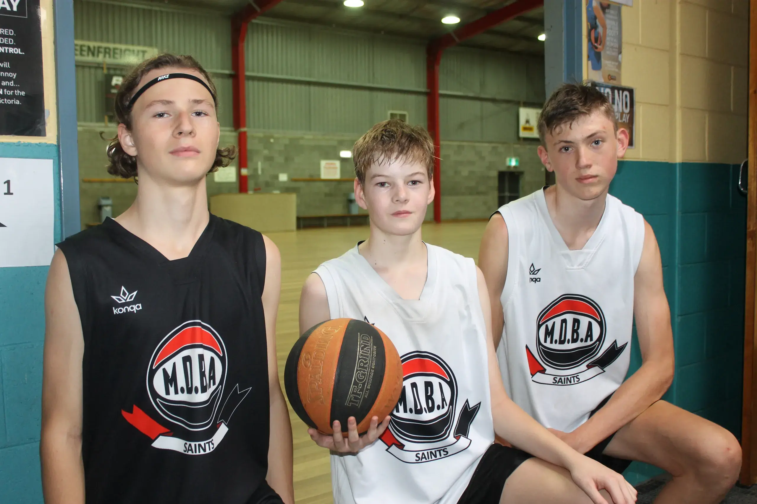 <p>PRACTISE POSTPONED: Myrtleford basketballers (from left) Will Koars, Tom Birch and Halen McIntyre are looking forward to using the resealed basketball court, which they use for practice a few times a week. PHOTO: Phoebe Morgan</p>\\n