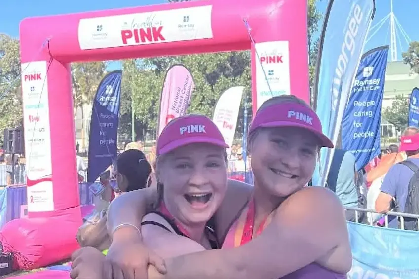 <p>TRIATHLON TRIUMPH: Sisters Makiah and Samara McCallum celebrated as they crossed the finish line, spurred on by support from their local community. PHOTO: McCallum family.</p>\\n