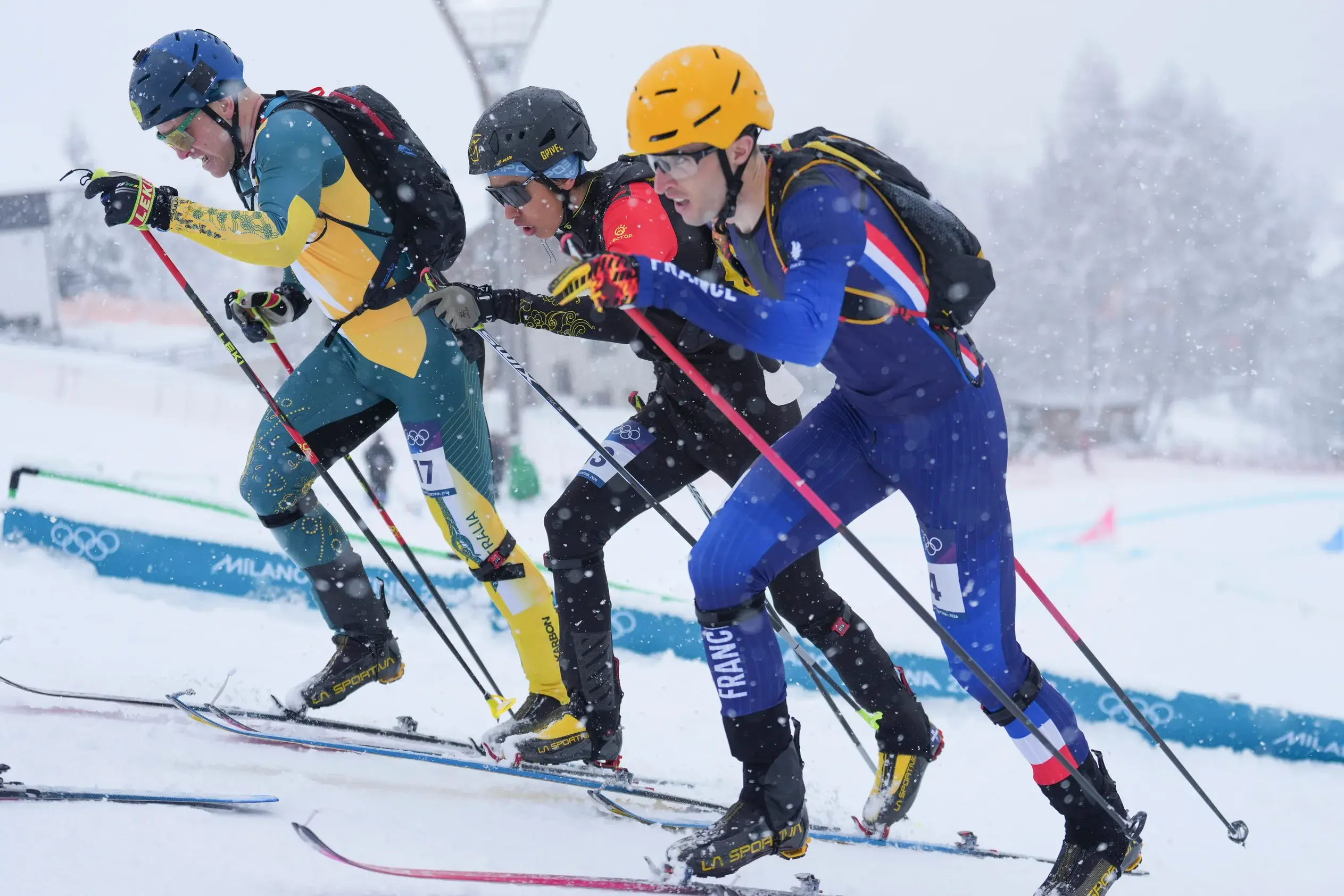 <p>OUR OLYMPIAN: Phil Bellingham (left) battling it out with China\\'s Bu Luer and France\\'s Thibault Anselmet in the semi-final of the men\\'s ski mountaineering sprints at the Milano Cortina 2026 Olympic Winter Games. PHOTO: AAP Photos/Hu Huhu</p>\\n