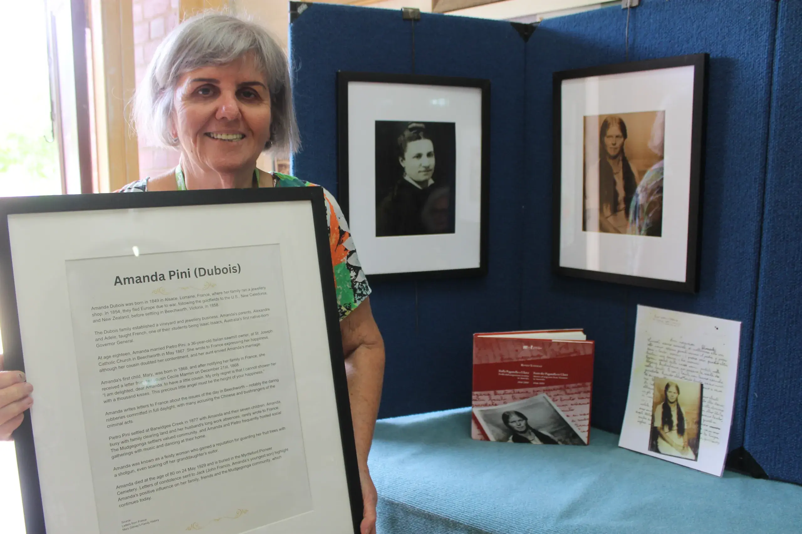 <p>A DOZEN DEDICATED DAMES: Myrtleford District Historical Society president, Kerry Murtagh, presents Amanda Pini\\'s information; ready to be assembled with her black and white photo and historical artefacts for the International Women\\'s Day exhibit. PHOTO: Phoebe Morgan</p>\\n