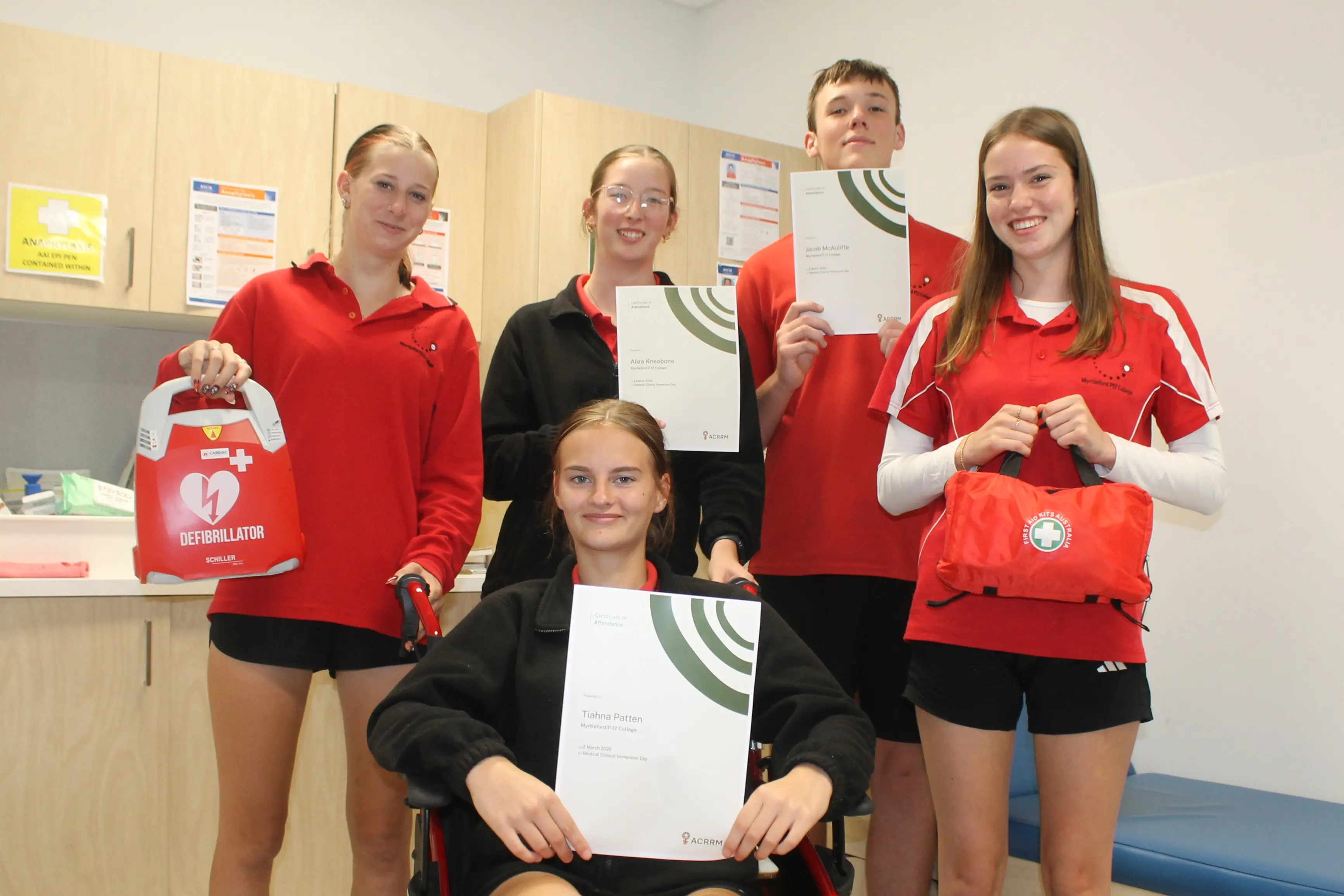 <p>ACADEMIC APPROACH TO HOLISTIC HEALTHCARE: Myrtleford P-12 students (from left) Amelia Midson, Tiahna Patten, Aliza Kneebone, Jacob McAuliffe and Sahra Pugh joined students from four other schools to celebrate Health Careers Week and get hands-on experience in the medical field. PHOTO: Phoebe Morgan</p>\\n