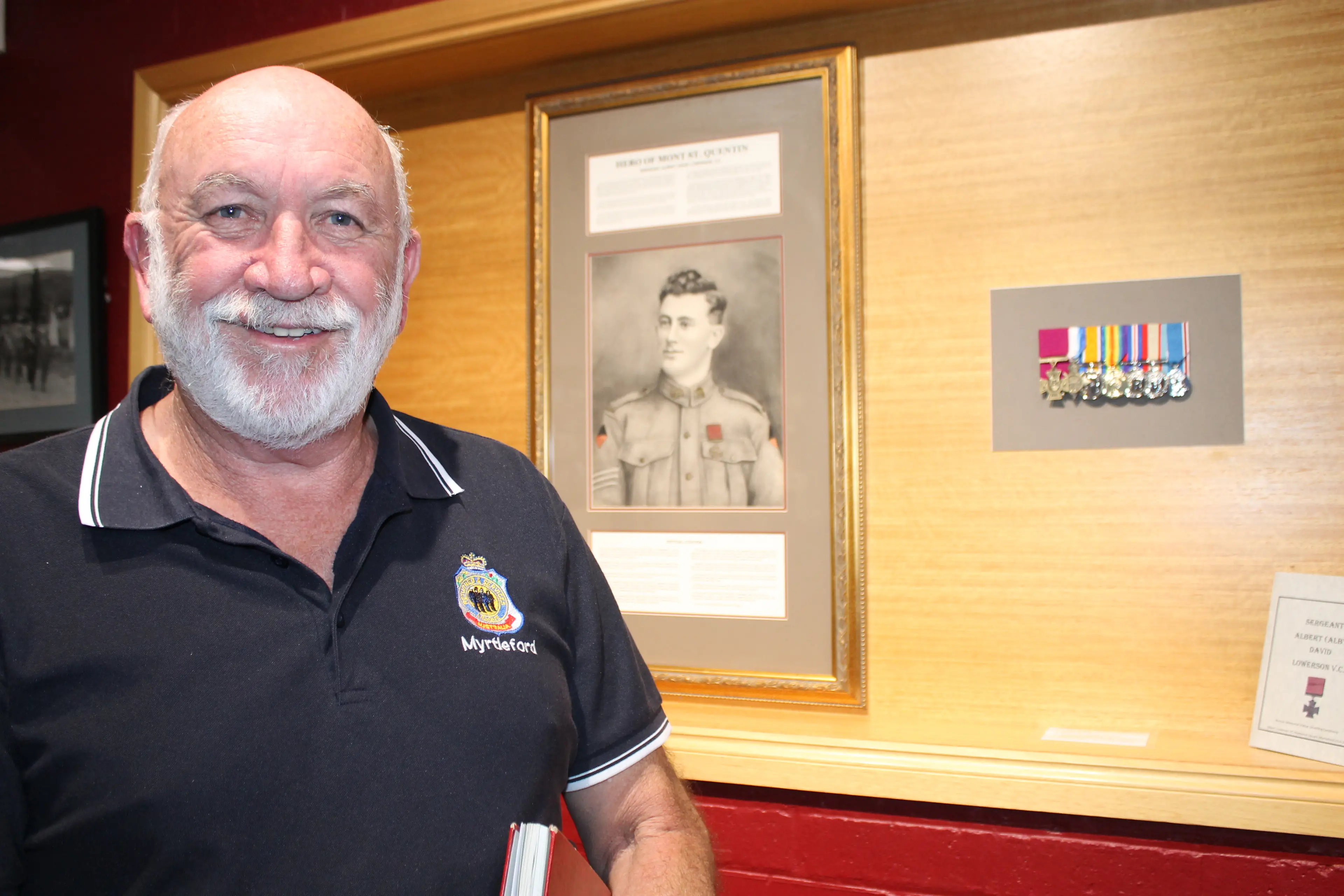 <p>LAUDED LOCAL\\'S MEMORY LIVES ON: Myrtleford RSL president, Brian McDonald, unveiled an updated AD Lowerson memorial display, now complete with a full replica set of his medals. PHOTOS: Phoebe Morgan</p>\\n