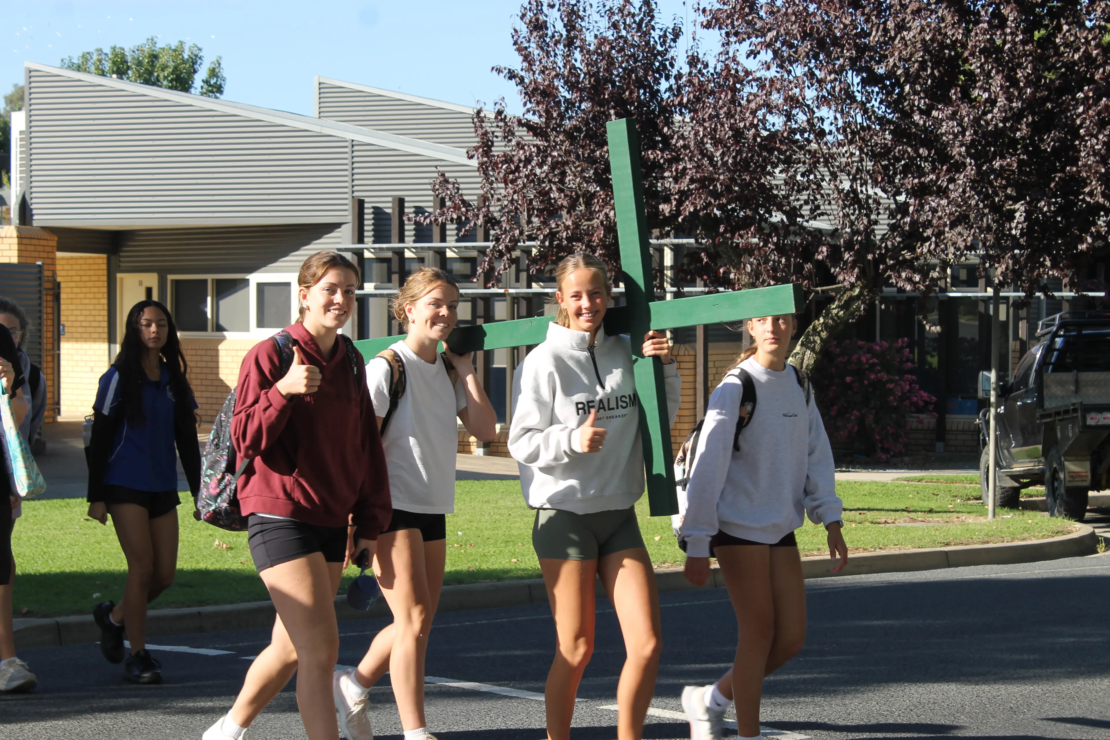 <p>FOOTSTEPS OF FAITH: Setting off early on Thursday morning,  students sharing carrying crosses to put themselves in Jesus\\' shoes ahead of the Easter break. PHOTO: Phoebe Morgan</p>\\n