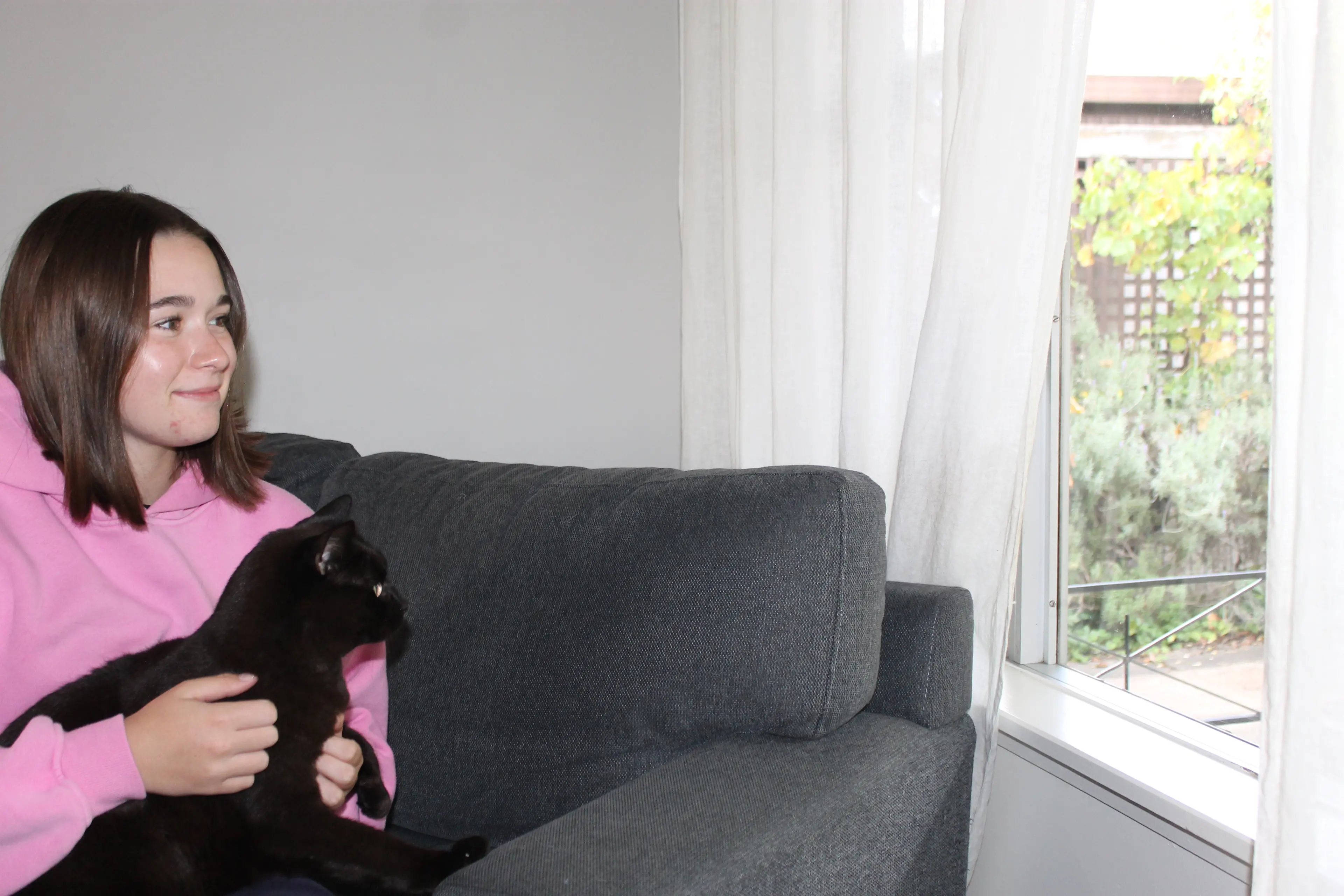 <p>PET POLICY IN PRACTICE: Myrtleford residents, Helina Murphy and Ninja the cat enjoyed a snuggly afternoon, safe indoors, instead of wandering outside looking for wildlife. PHOTO: Phoebe Morgan</p>\\n