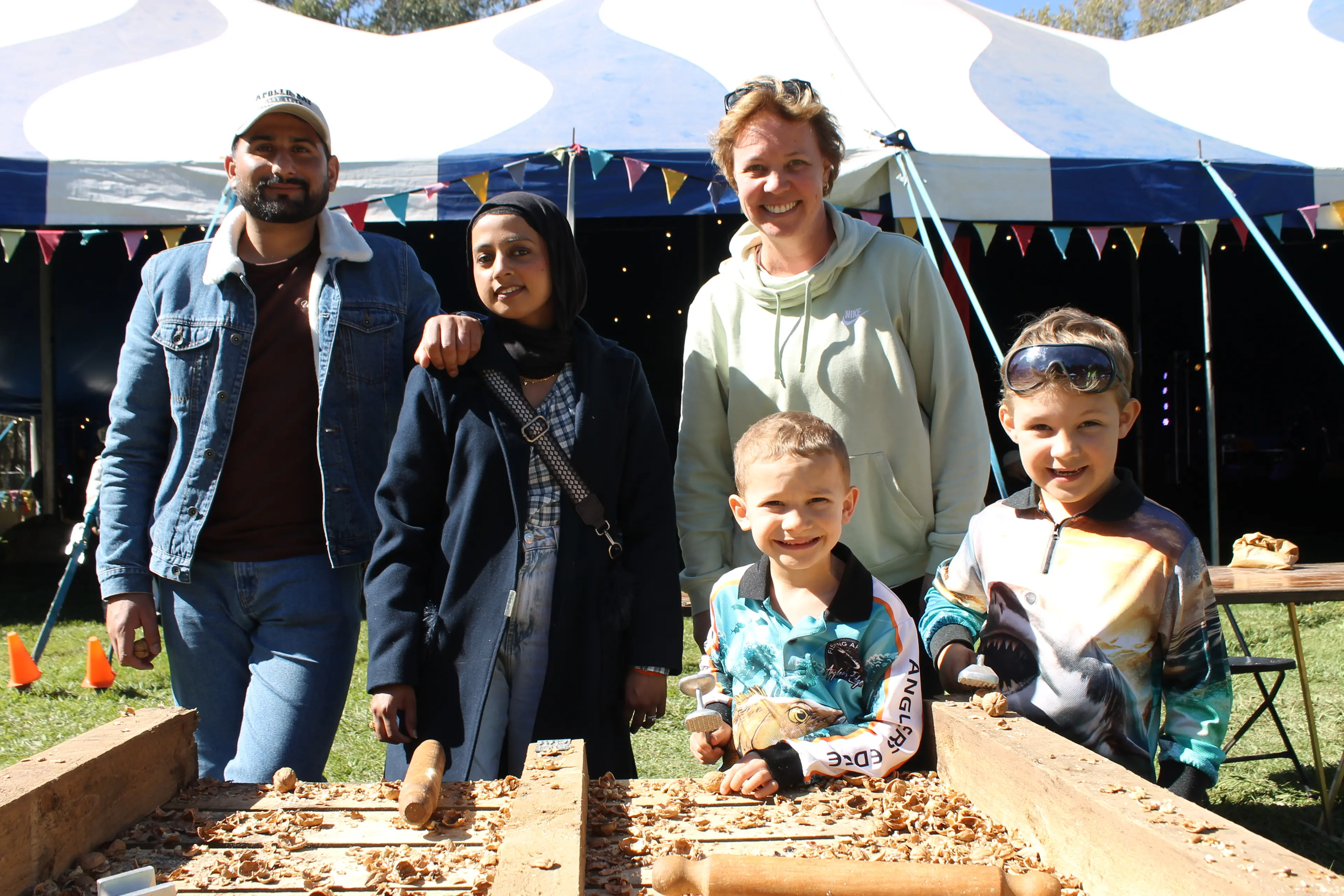 <p>WIELDING A MASTERFUL MALLET AT WANDI: (from left) Adeel and Uswa Shah and Kellie, Lucas and John Dissegna worked to crack open delicious walnuts and get in the Wandi Nut Festival spirit. PHOTOS: Phoebe Morgan.</p>\\n
