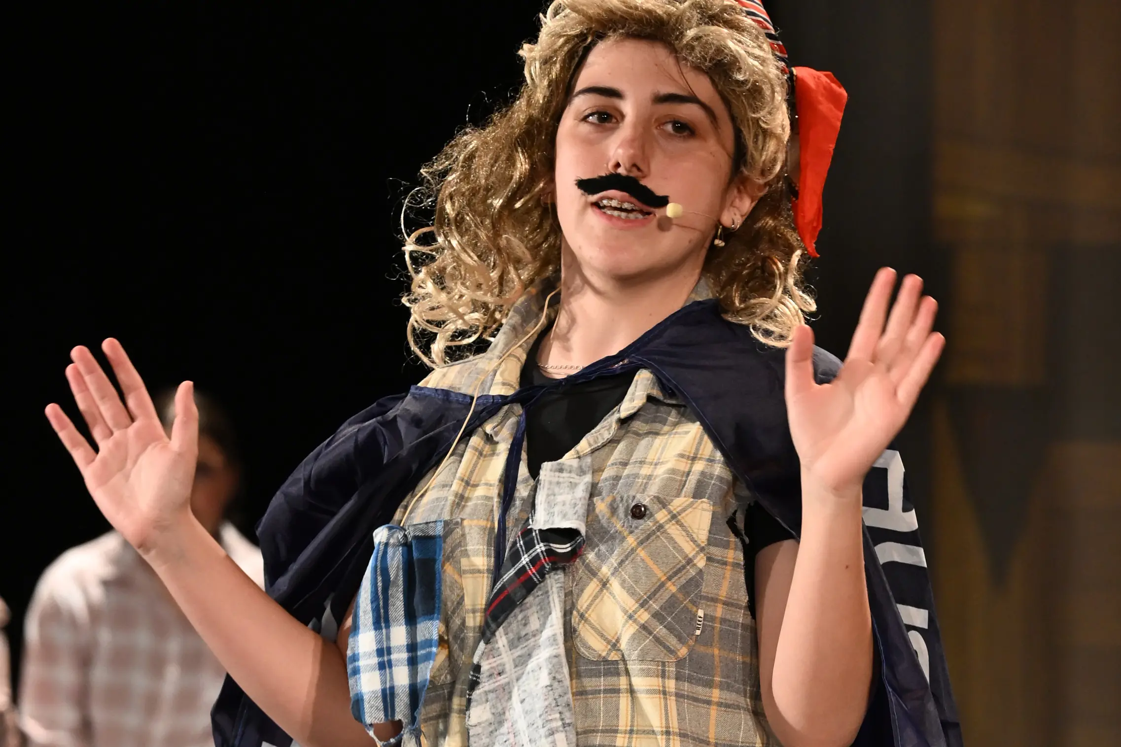 <p>KEEP YOUR MUSTACHE ON: Nothing says \\'Aussie\\' like a flanno, mullet and flag. PHOTOS: Marian College.</p>\\n