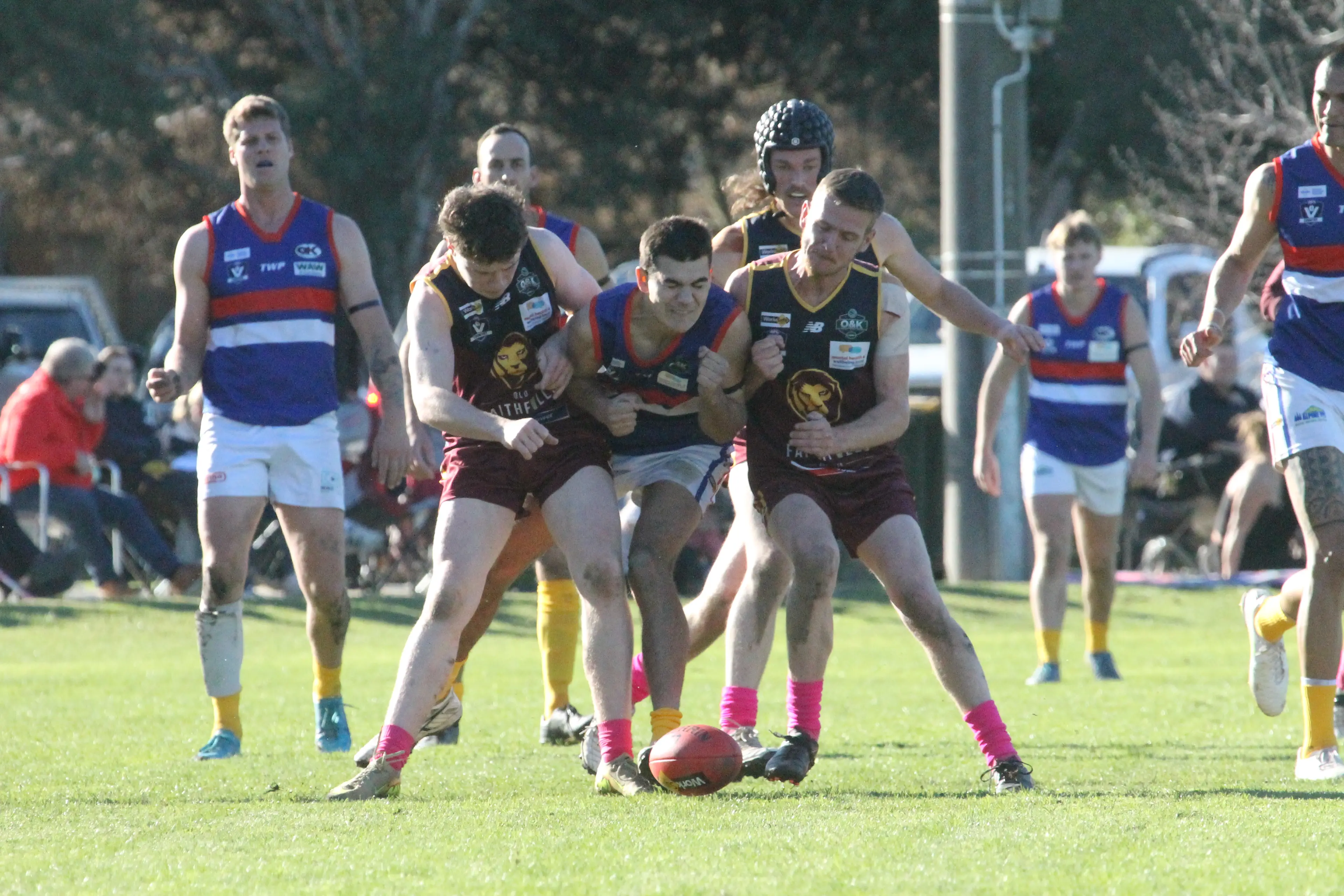 <p>CRUNCH: Whorouly footballers Harvey Dodgshun and Jacob Penn sandwich their Tarrawingee opponent. PHOTOS: Nathan de Vries</p>\\n