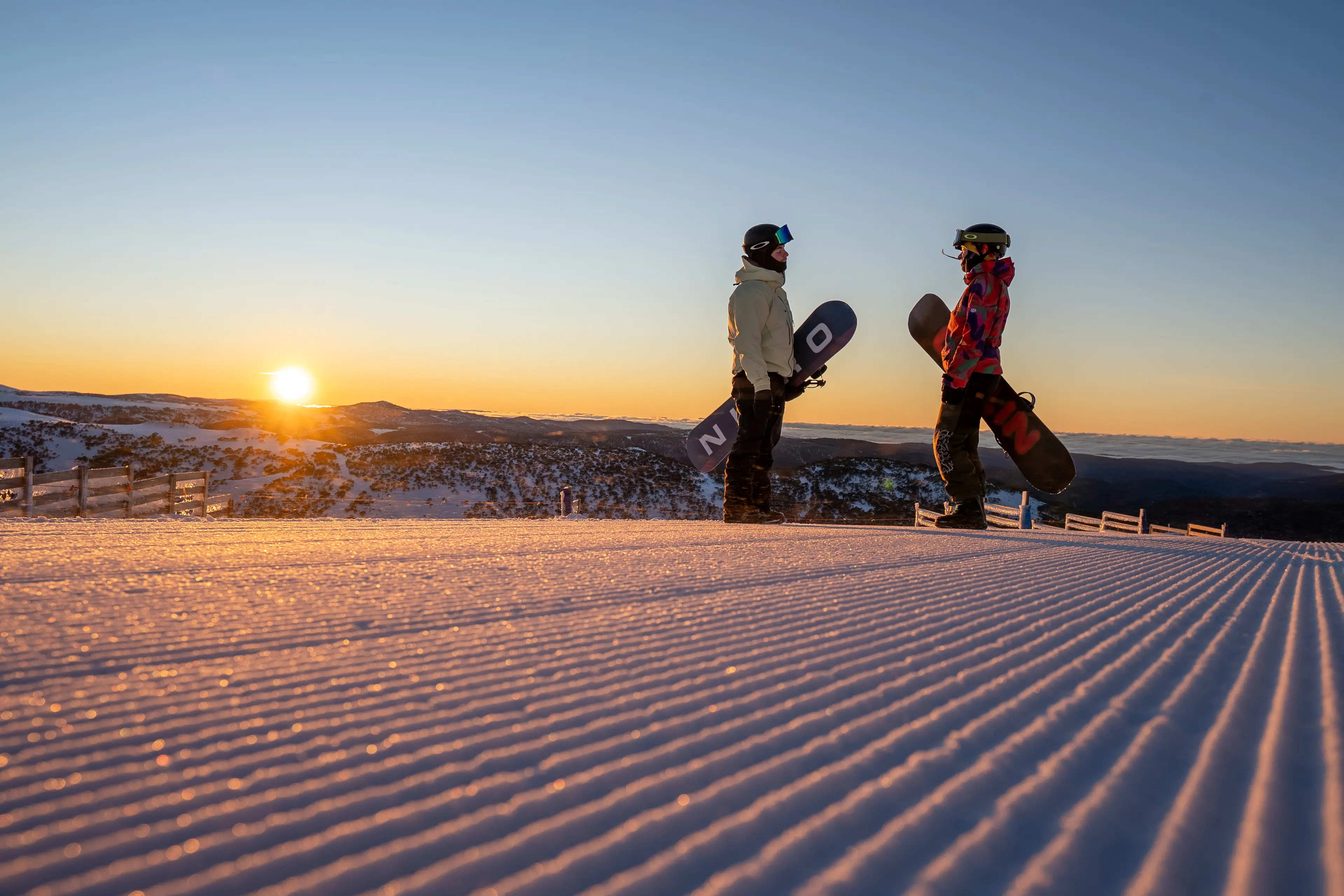 <p>MAGIC CORDUROY AT SUNRISE: Hotham snowboarders Dylan Walker (left) and Brielle \\u2018Breezy\\u2019 Hayes were ready for the 7.30am sunrise start, getting first runs on the magic corduroy surface at the Summit in mid-July. PHOTO: Chris Hocking, Vail Resorts</p>\\n
