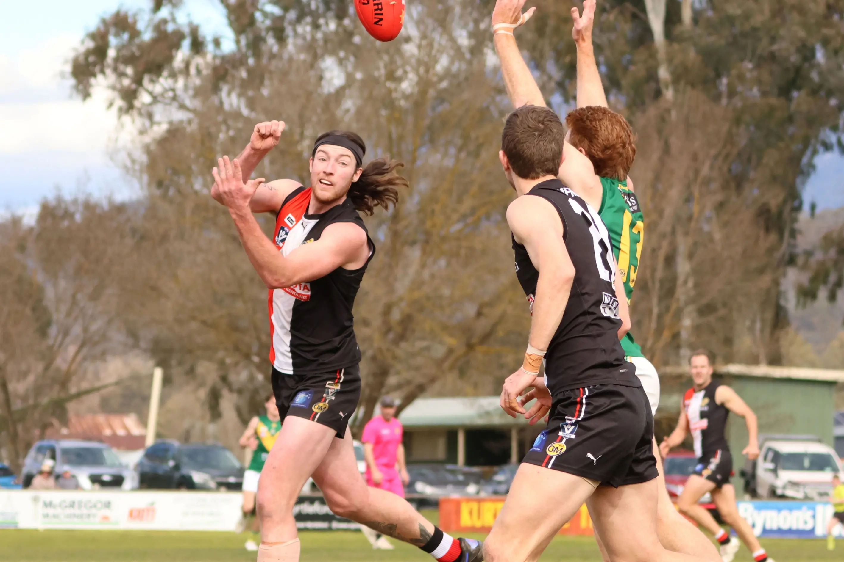 <p>OVER THE TOP: Riley Smith pops a handball up. PHOTO: Janet Watt</p>\\n