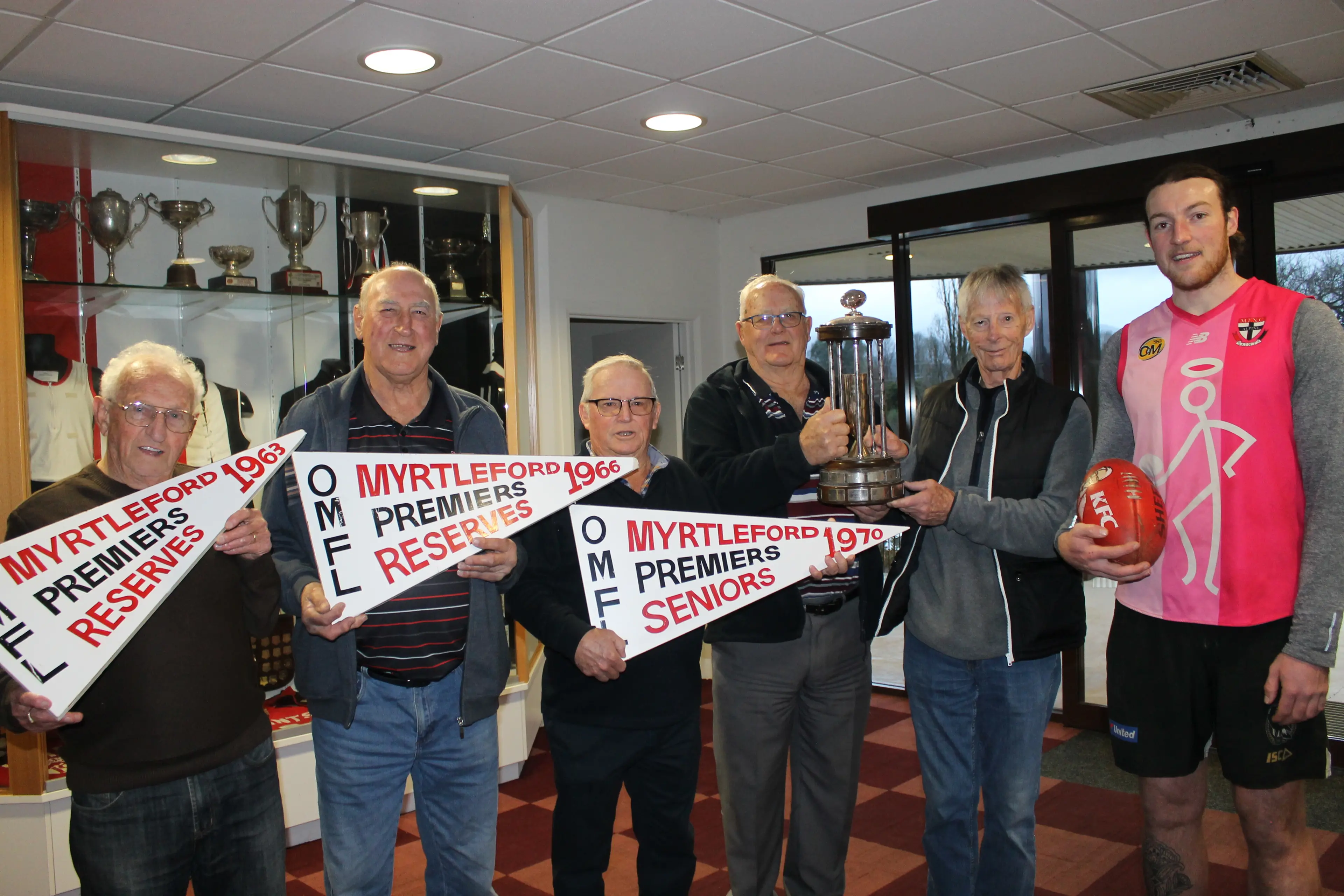 <p>PENNANT PRIDE: Myrtleford\\'s previous Saints (from left) Kevin Dinneen, Alan Crisp, Denis Piazza, John Doodeward and Alan Heberle caught up with current club footballer, Riley Smith to wish him and the team well this season and take a walk down memory lane. PHOTO: Phoebe Morgan</p>\\n